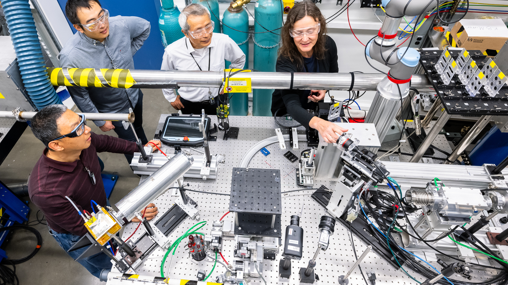 Photograph of researchers working together on X-ray measurements at the APS.