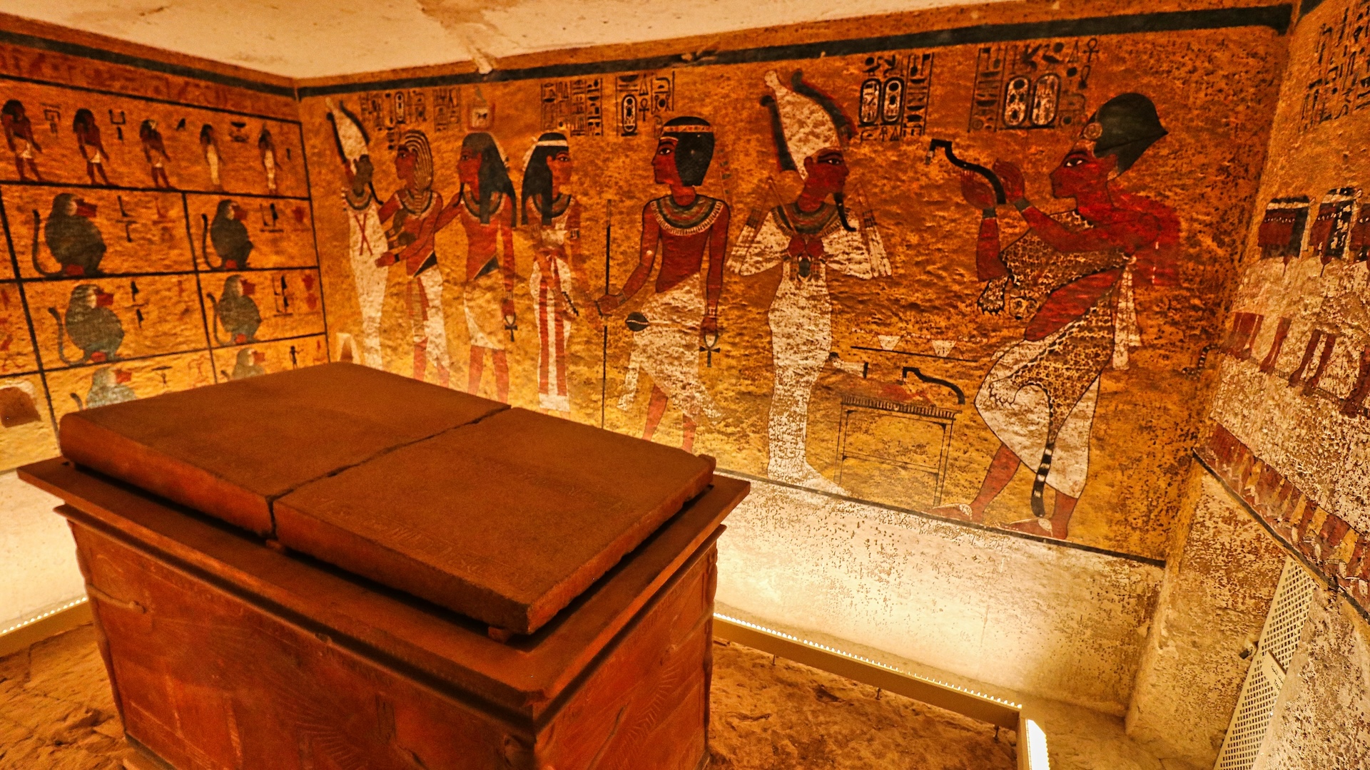 a view inside King Tut's tomb with murals on the walls