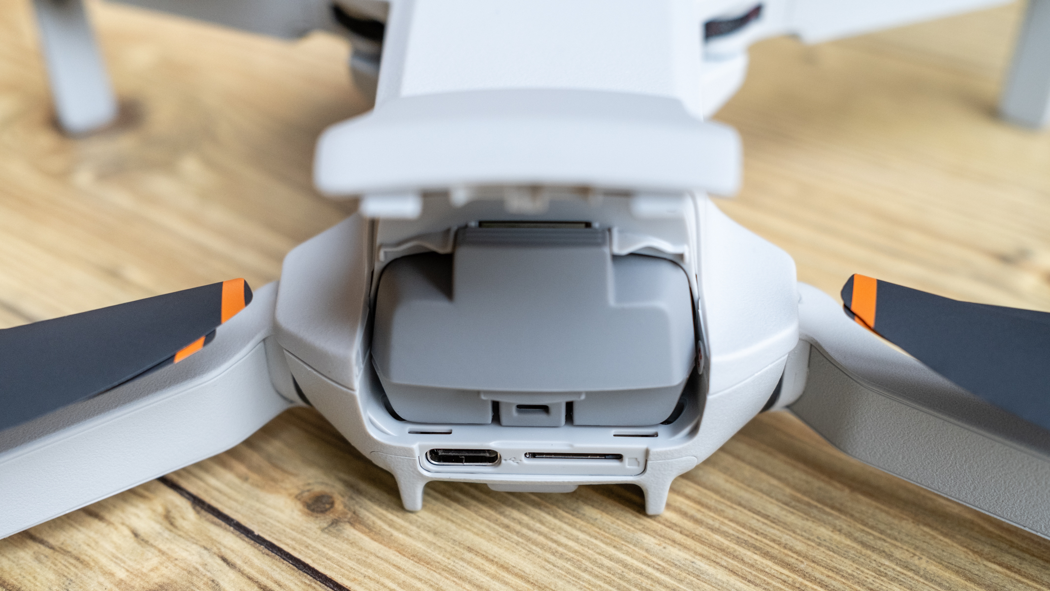 DJI Mini 4K with the battery compartment open