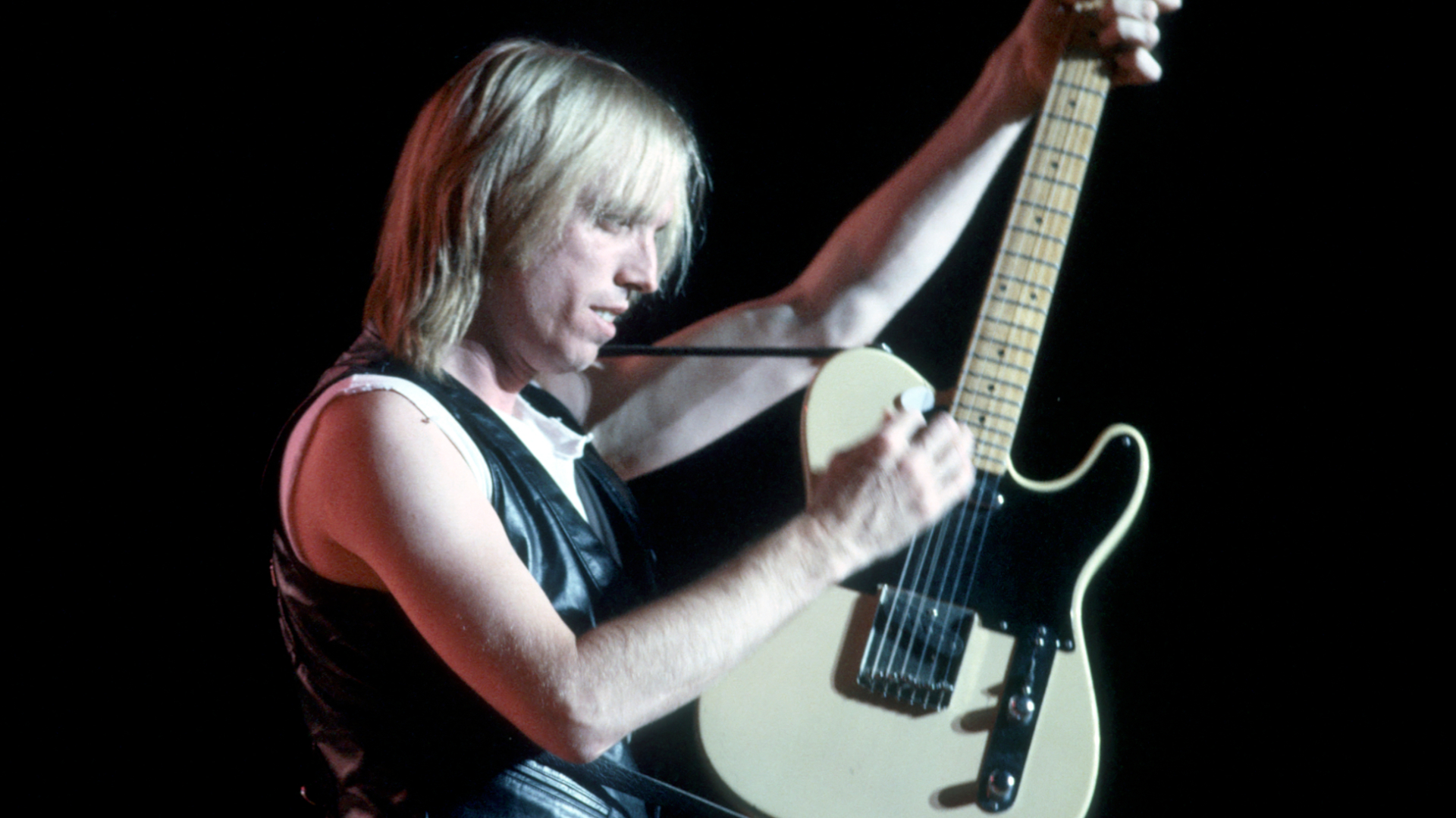 Tom Petty performs onstage with a Fender Telecaster.