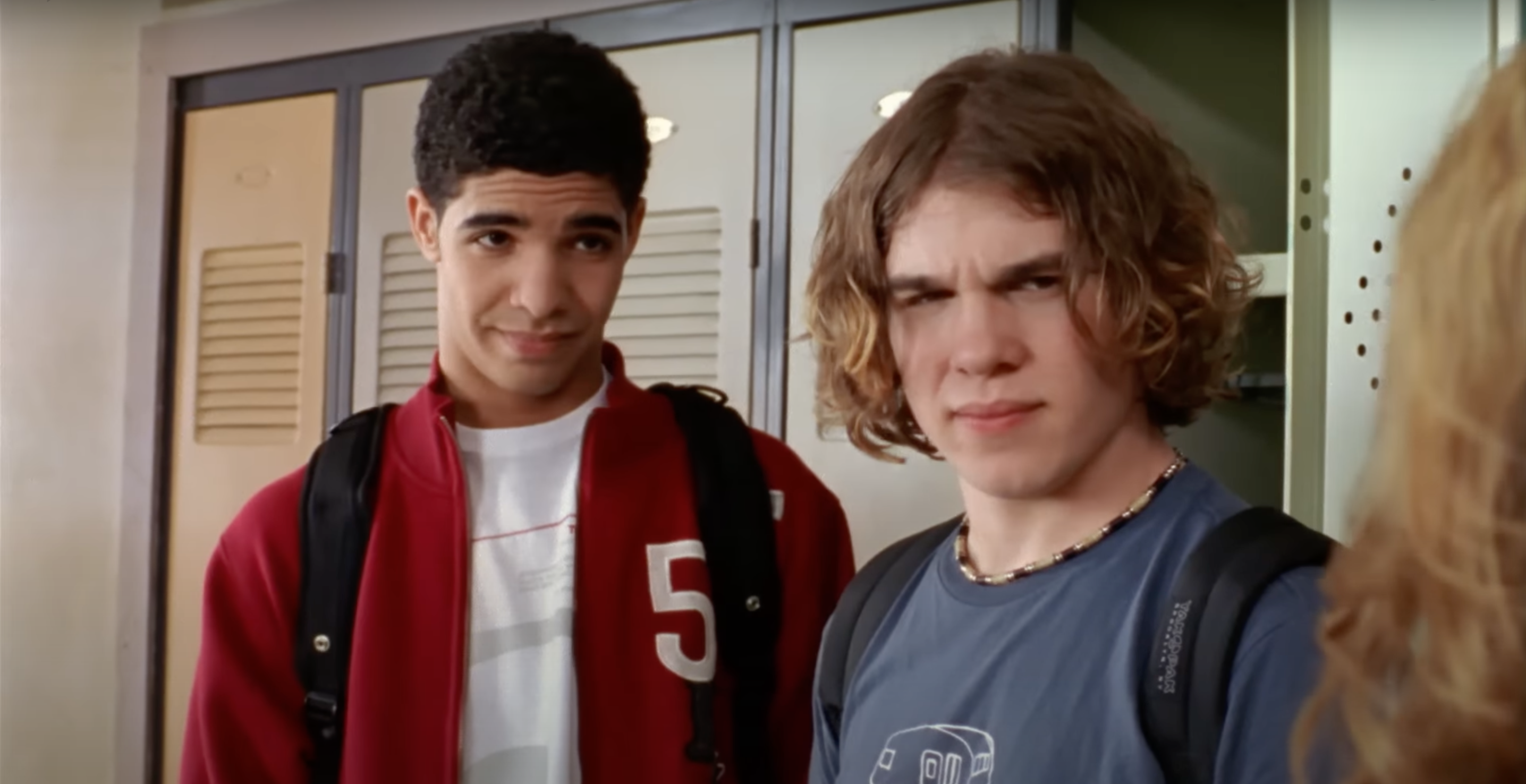 Jimmy and Spinner looking skeptically at Paige in Degrassi: The Next Generation
