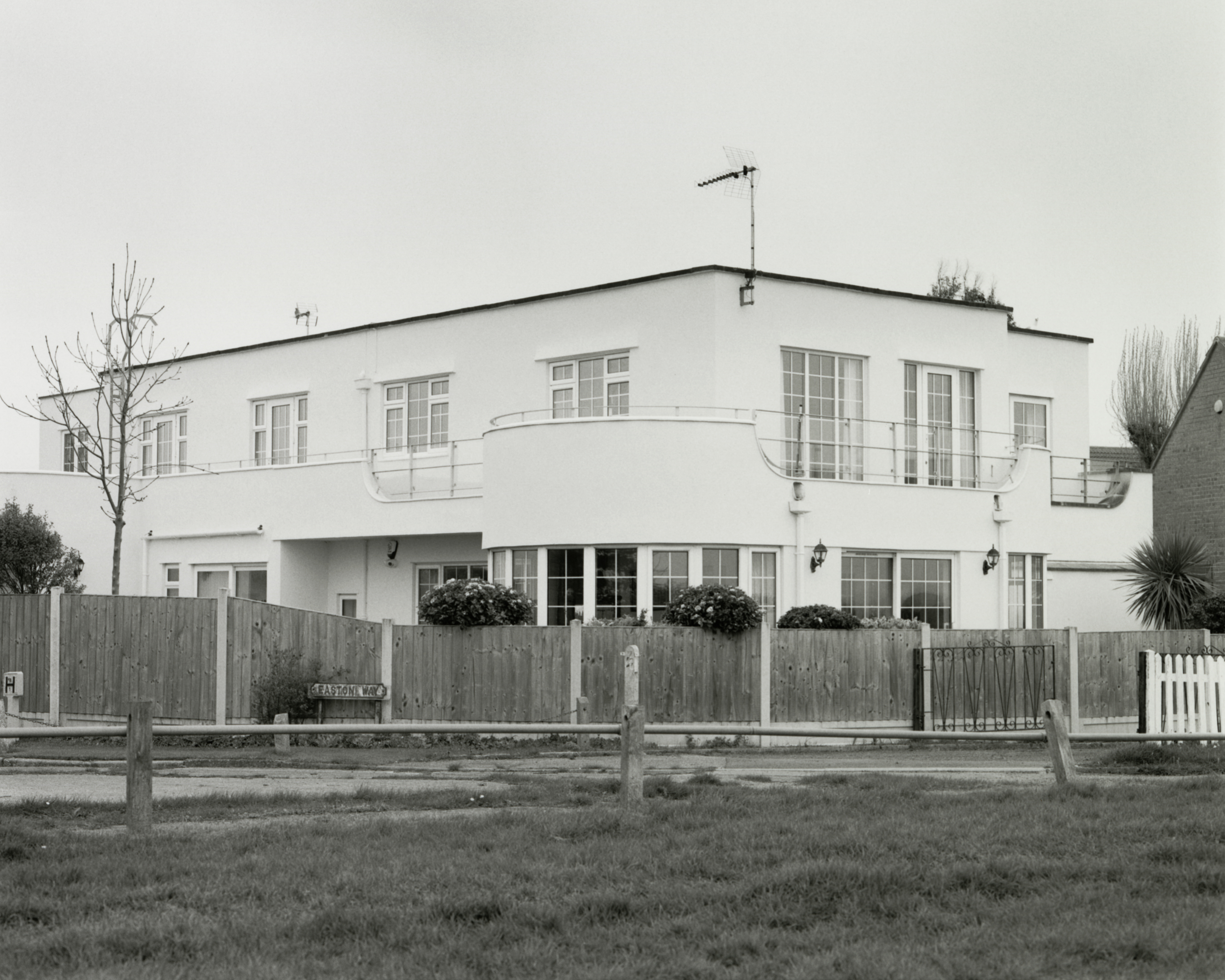 frinton park estate book image showing white modernist villa in black and white