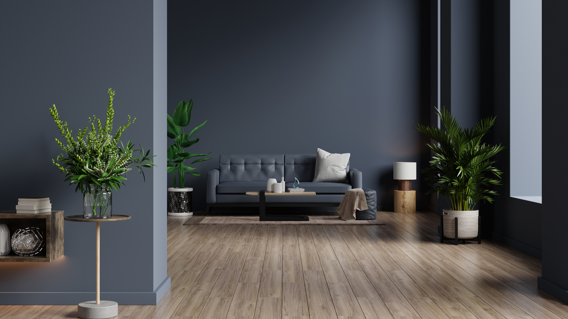 Living room with dark blue walls to show how to decorate with dark colors to maximum effect