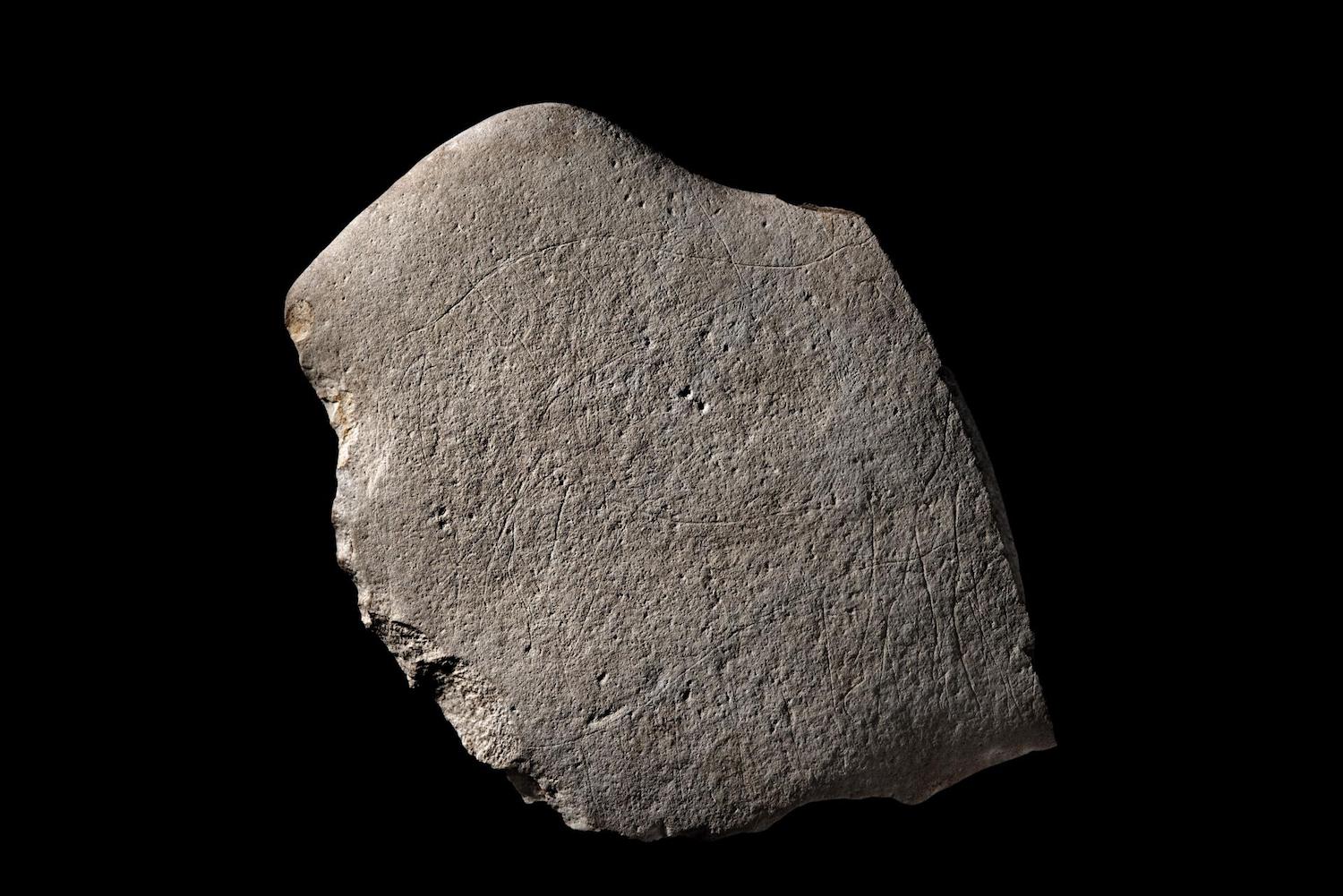 A sandstone that was engraved with images of horses and other animals about 12,000 years ago.