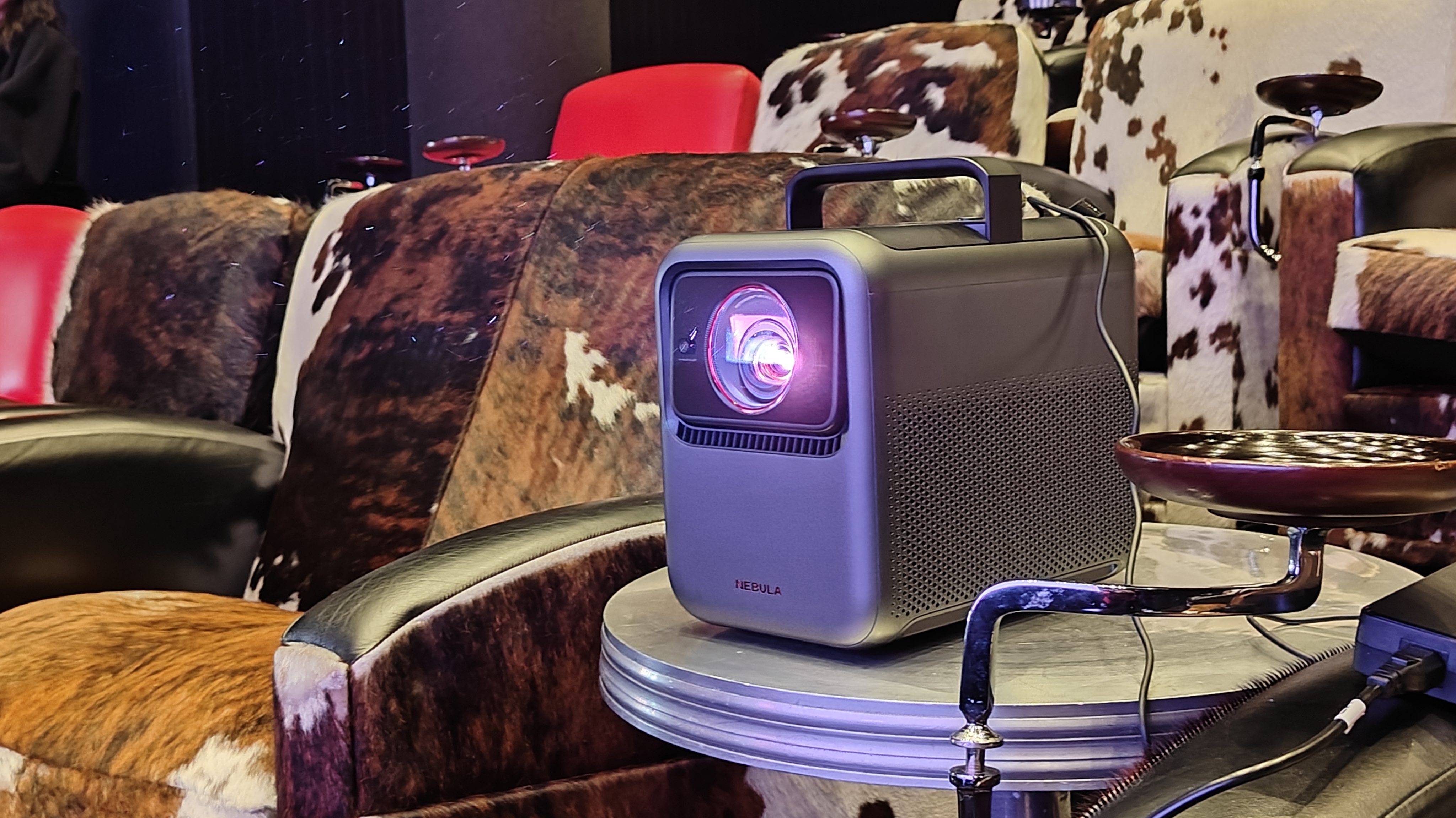 Nebula X1 on a metal table in a screening room