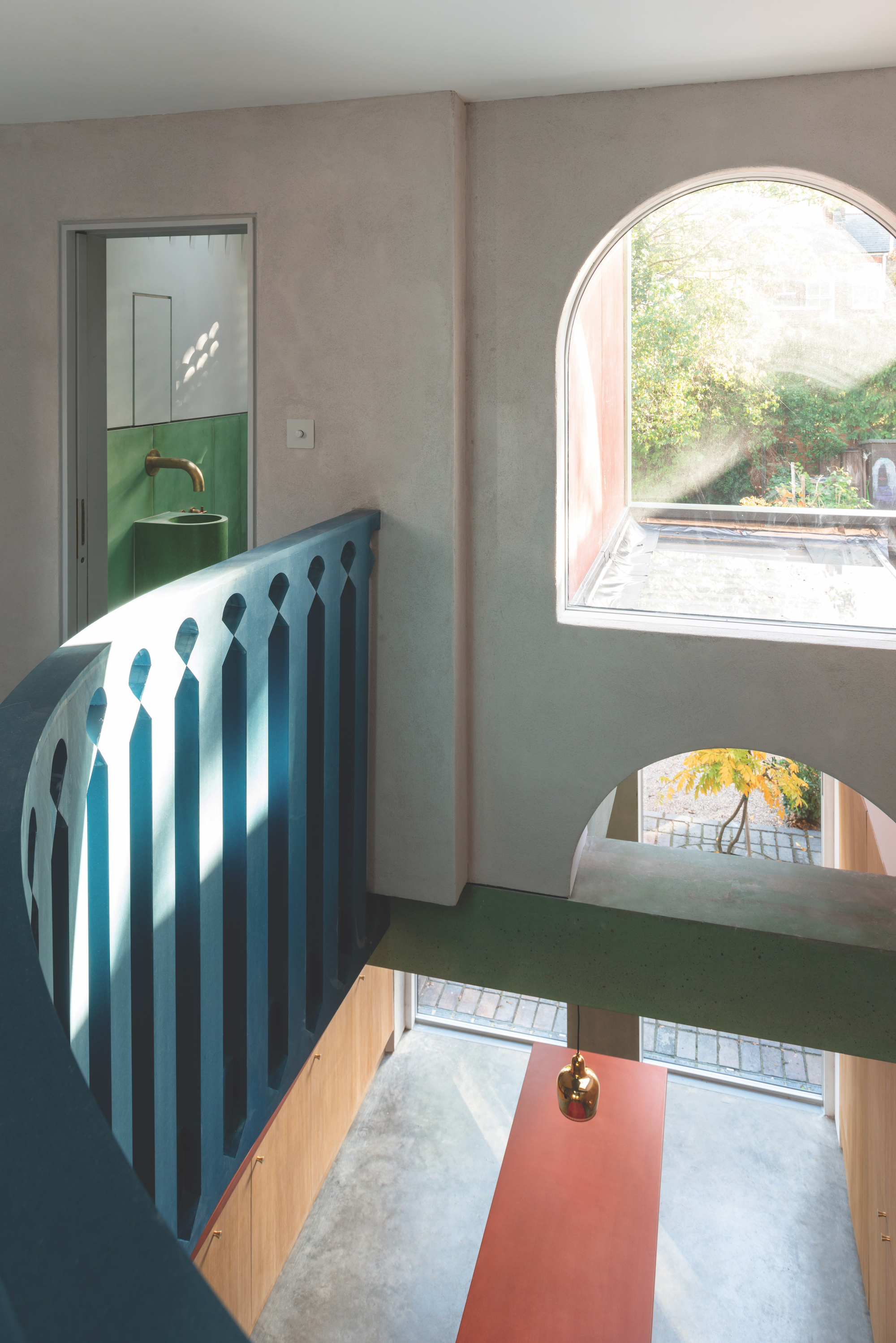 curved landing area with large arch window
