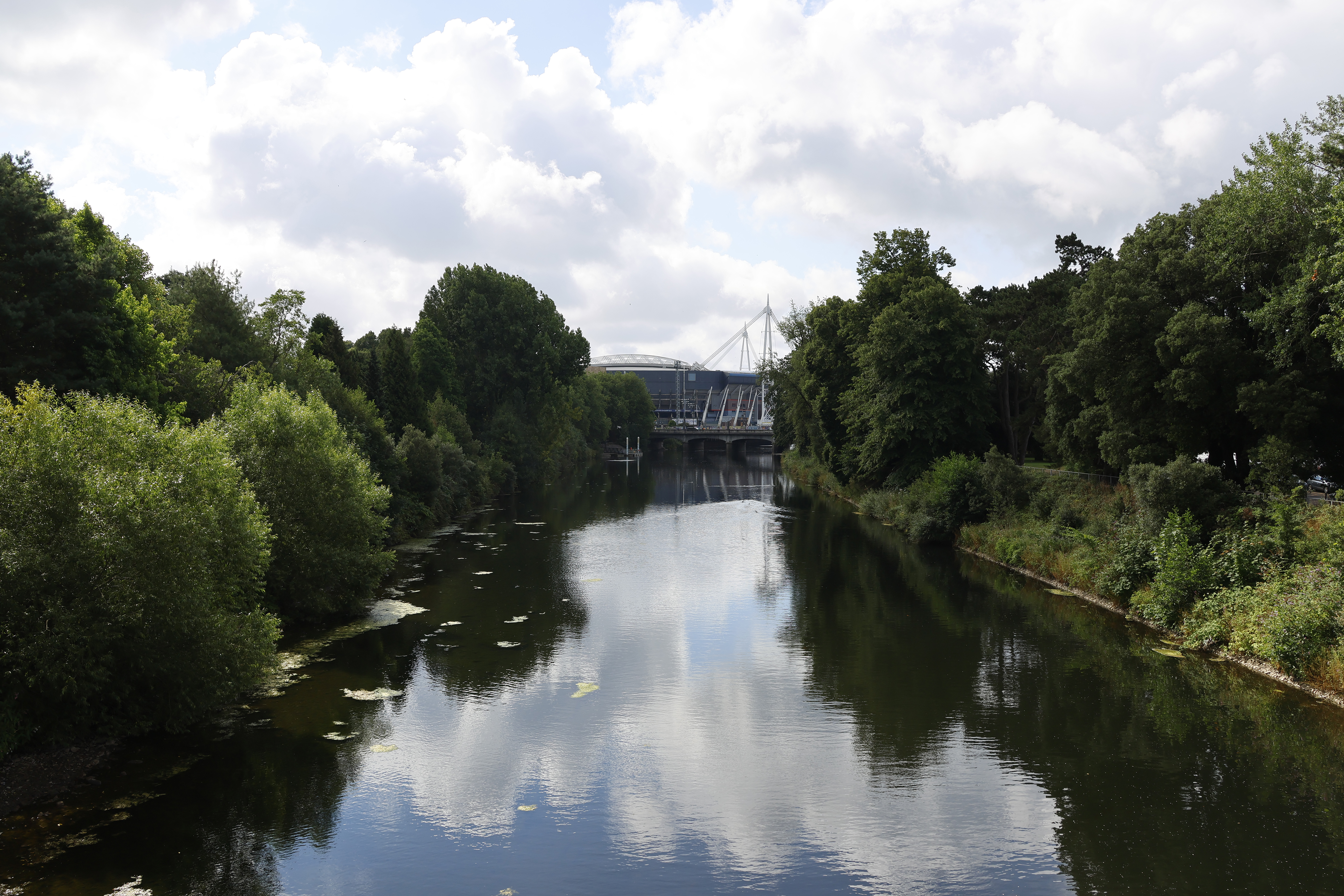 A river running towards a stadium