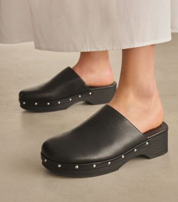 Image of black clogs