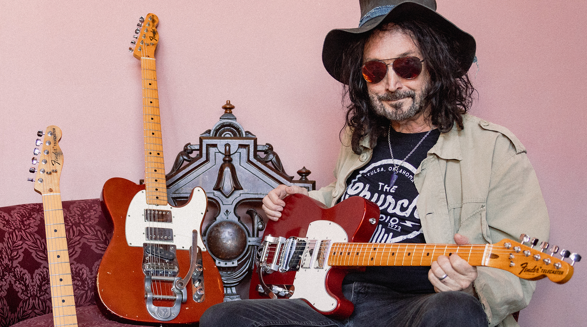 Mike Campbell poses with his Red Dog Fender Telecaster and a pair of 2025 tribute models Fender created on behalf of the instrument