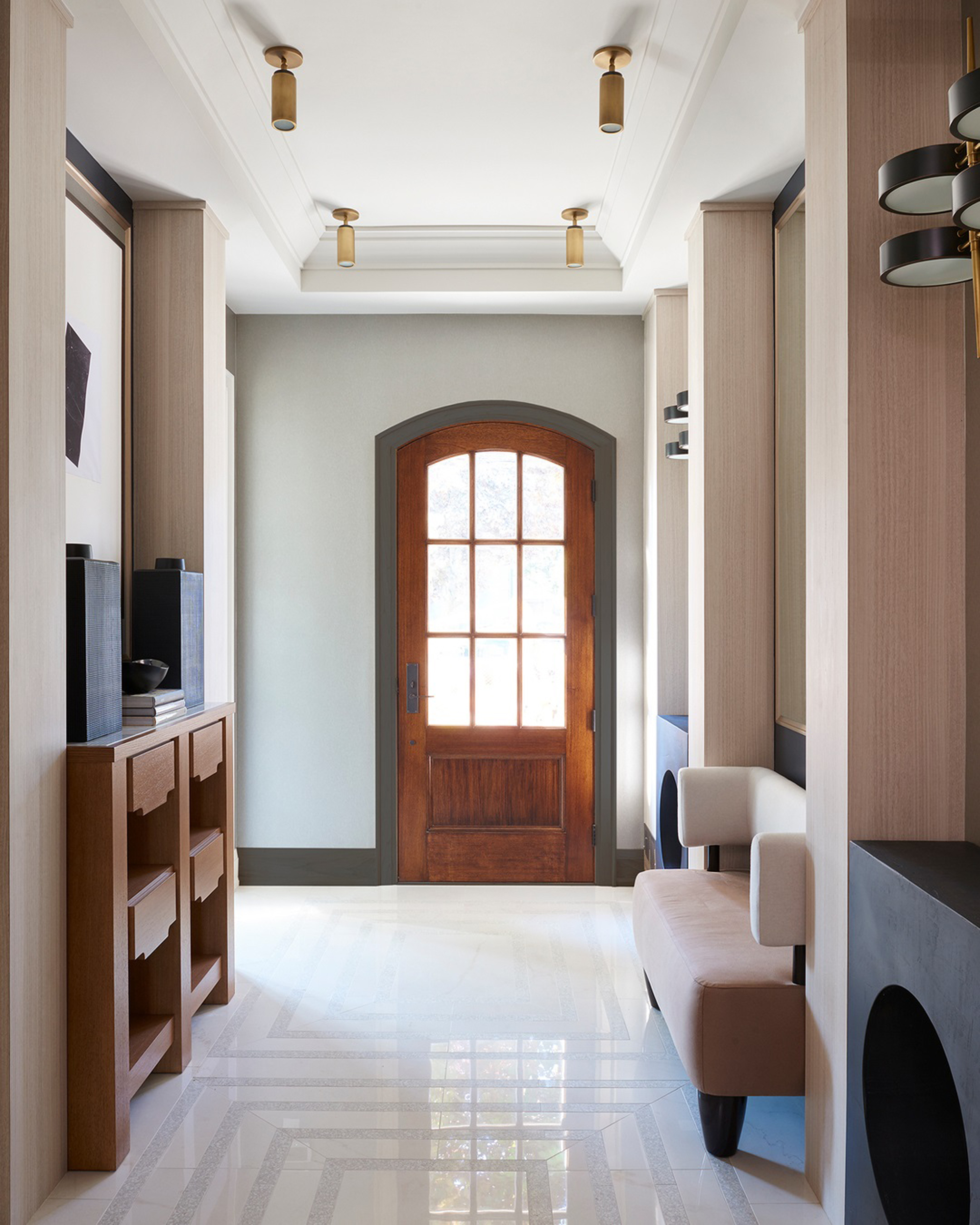 a modern entryway with a small bench