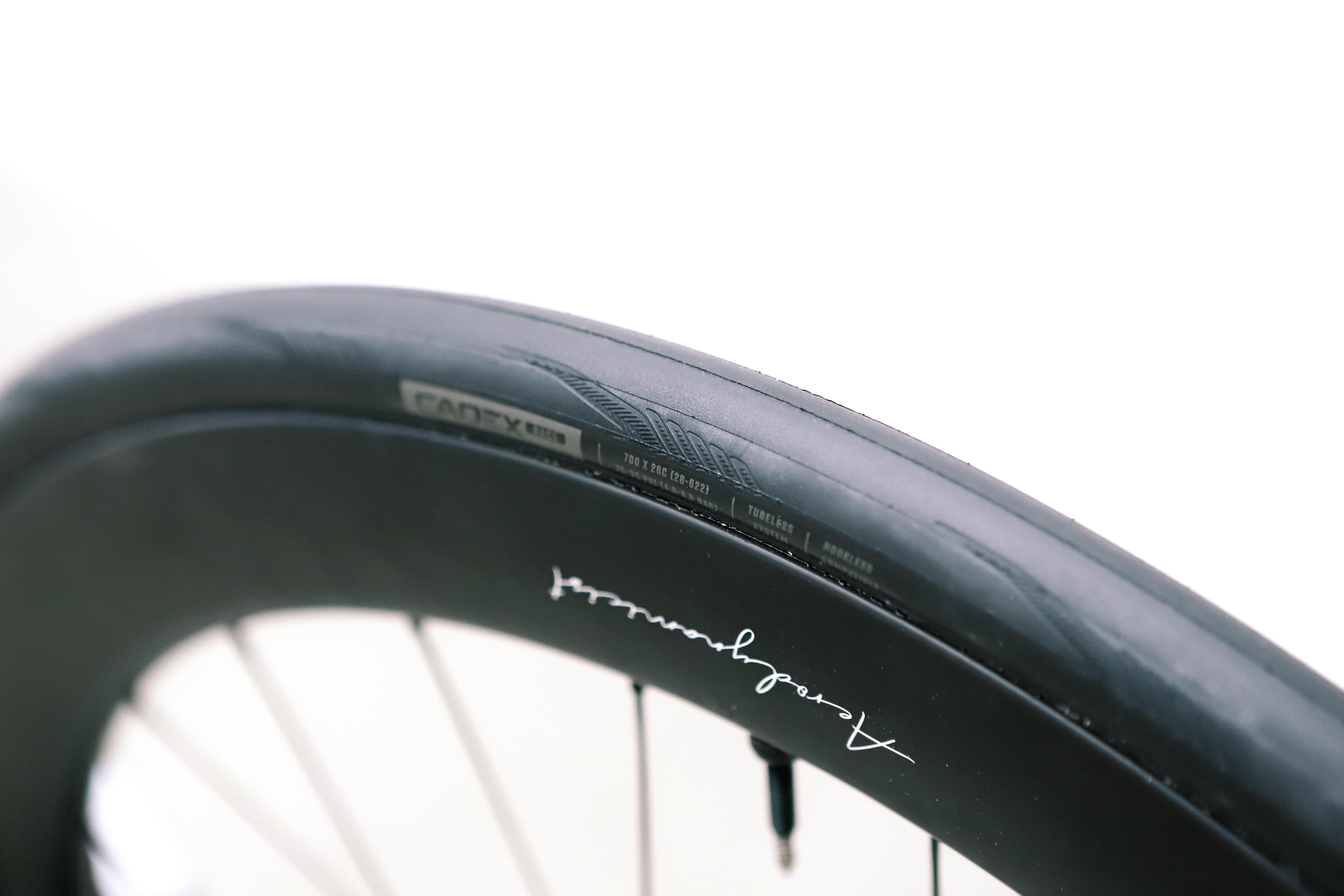 a close up of a black road bike tyre