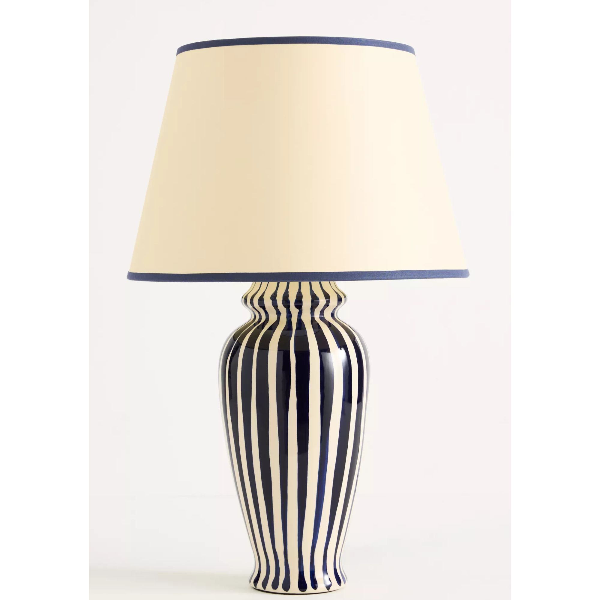 Striped black and white lamp with blue and cream shade