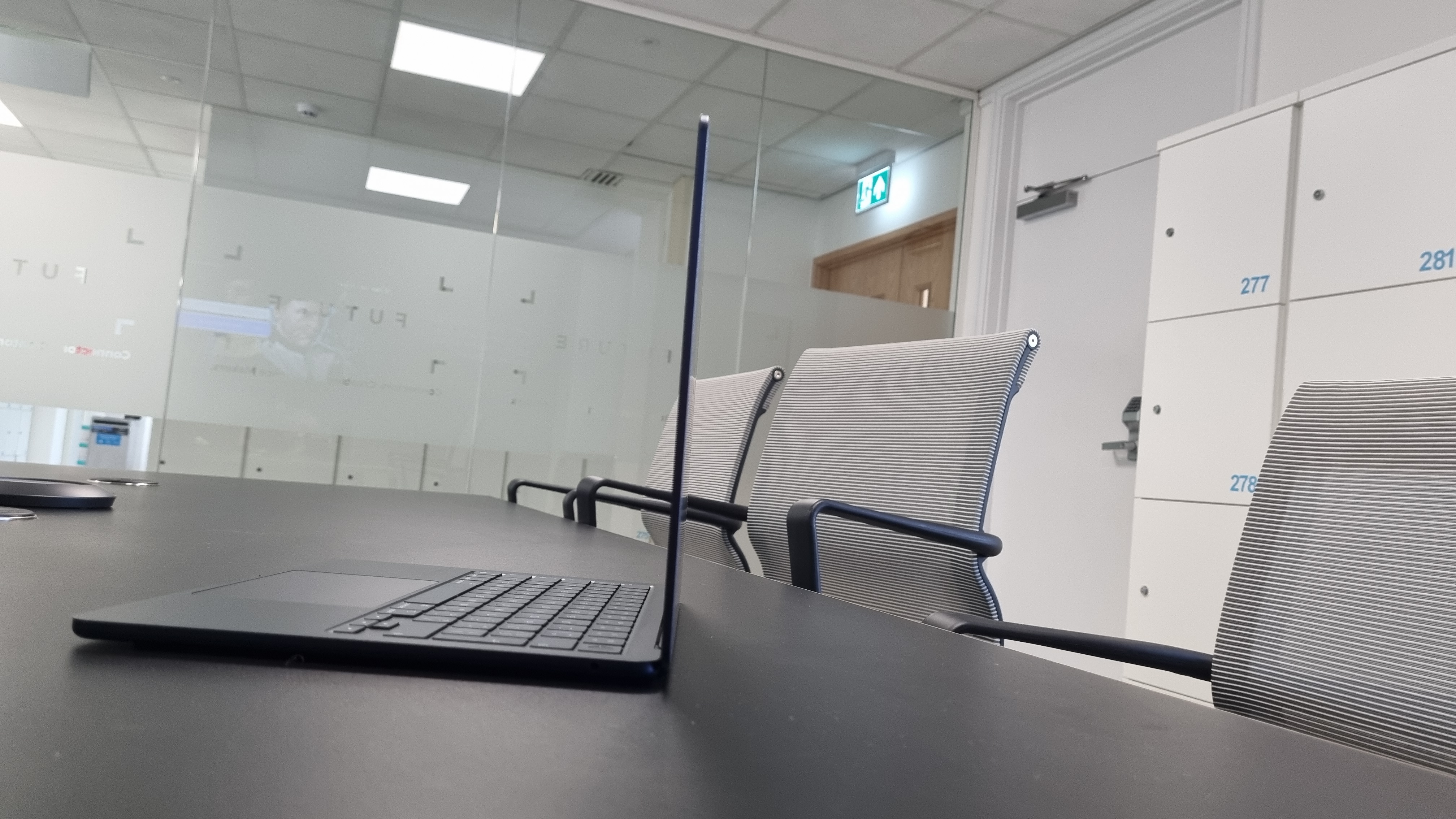 MacBook Air laptop in an office on a black desk