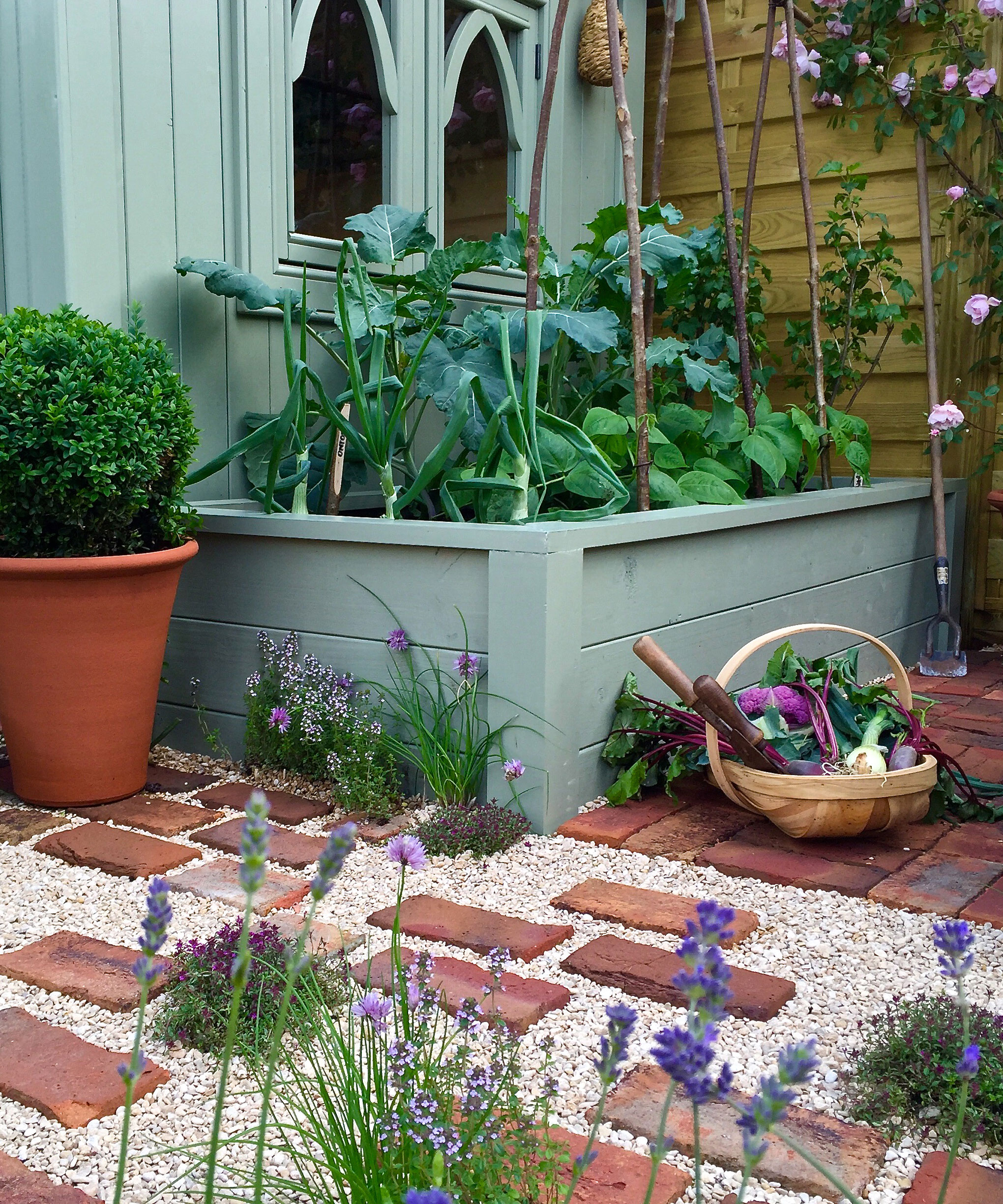 raised garden bed painted green