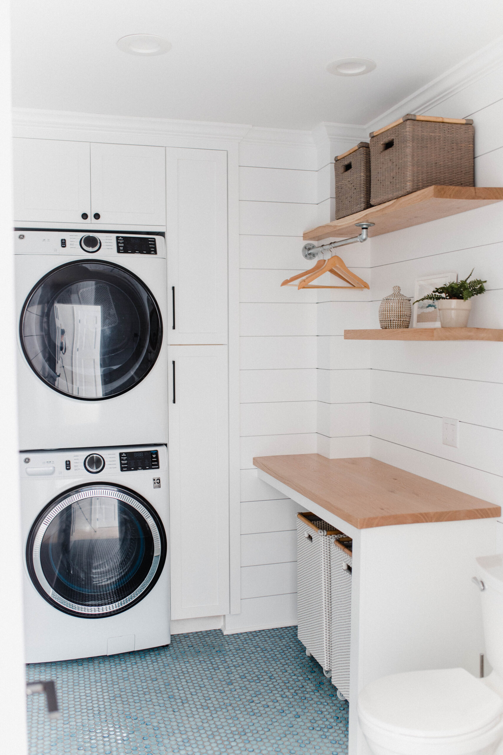 laundry room with white cabinets