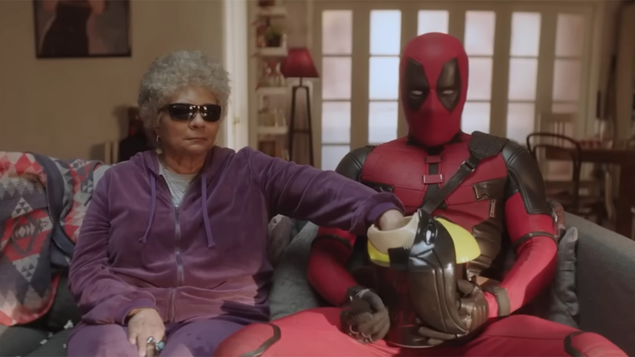 Blind Al and Deadpool eating popcorn out of the lewd Wolverine bucket in ad for Disney+ release of Deadpool &amp; Wolverine.
