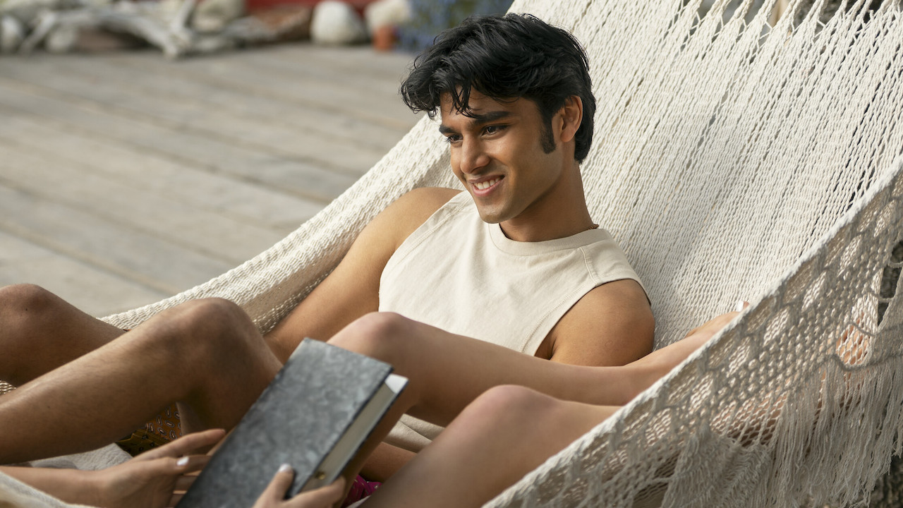 Shubham Maheshwari as Gat sitting on a hammock in We Were Liars