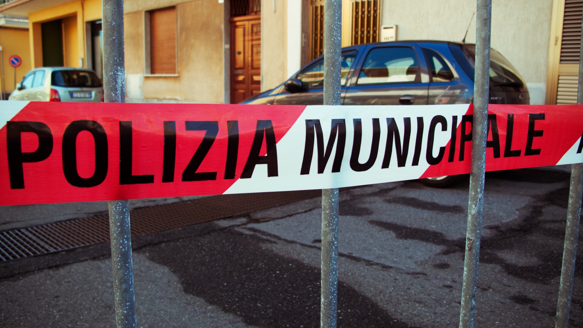 Police cordon tape in a street of a small town in Sicily, Italy