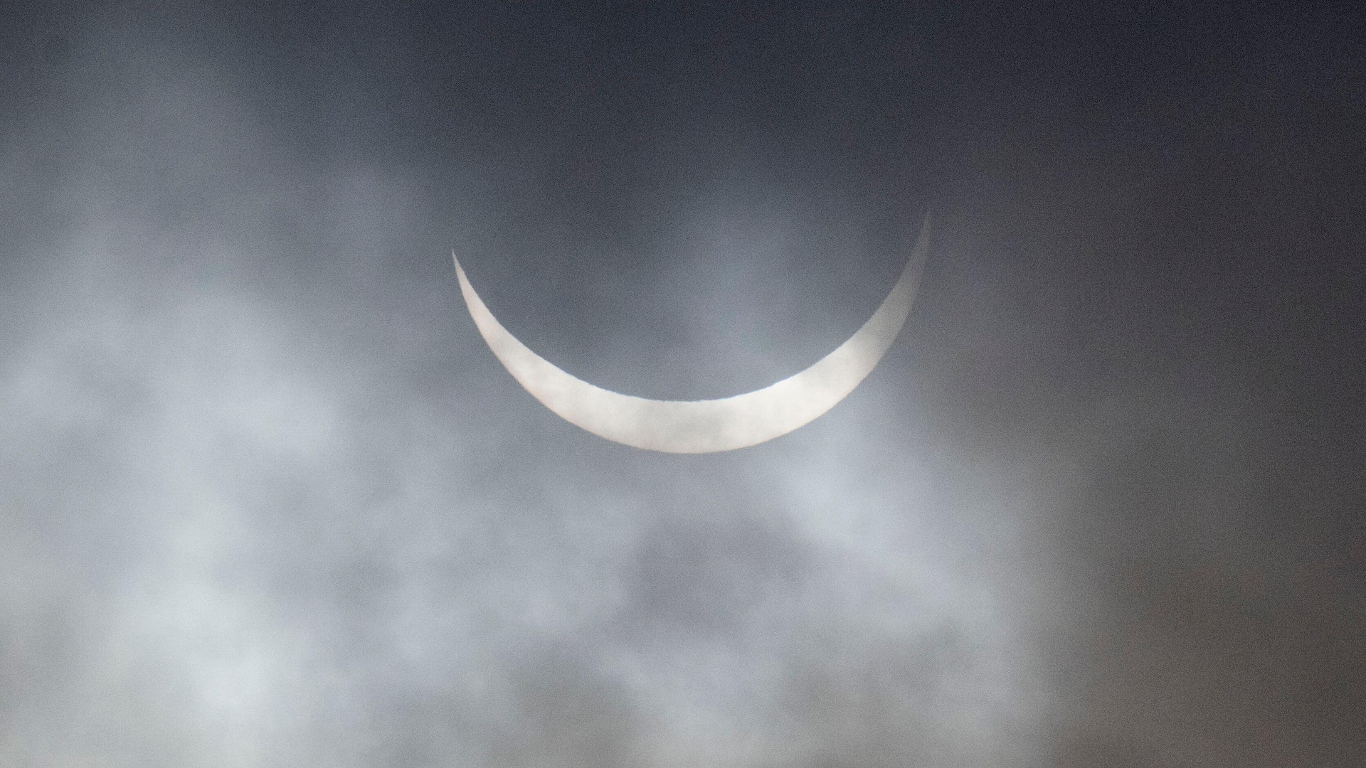 The sun in a very thin crescent shape during a solar eclipse