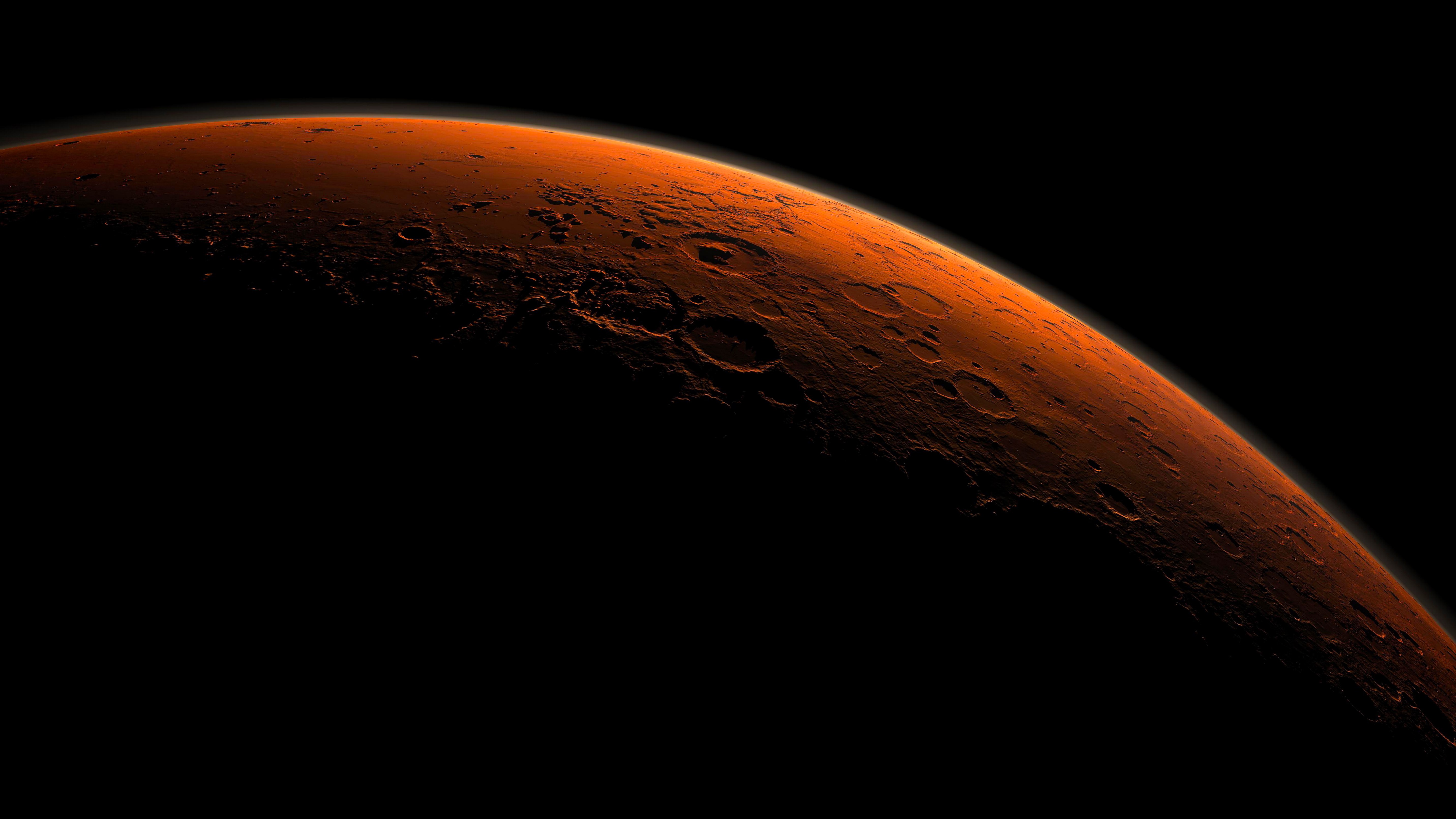 An artist's illustration of Mars's Gale Crater beginning to catch the morning light.