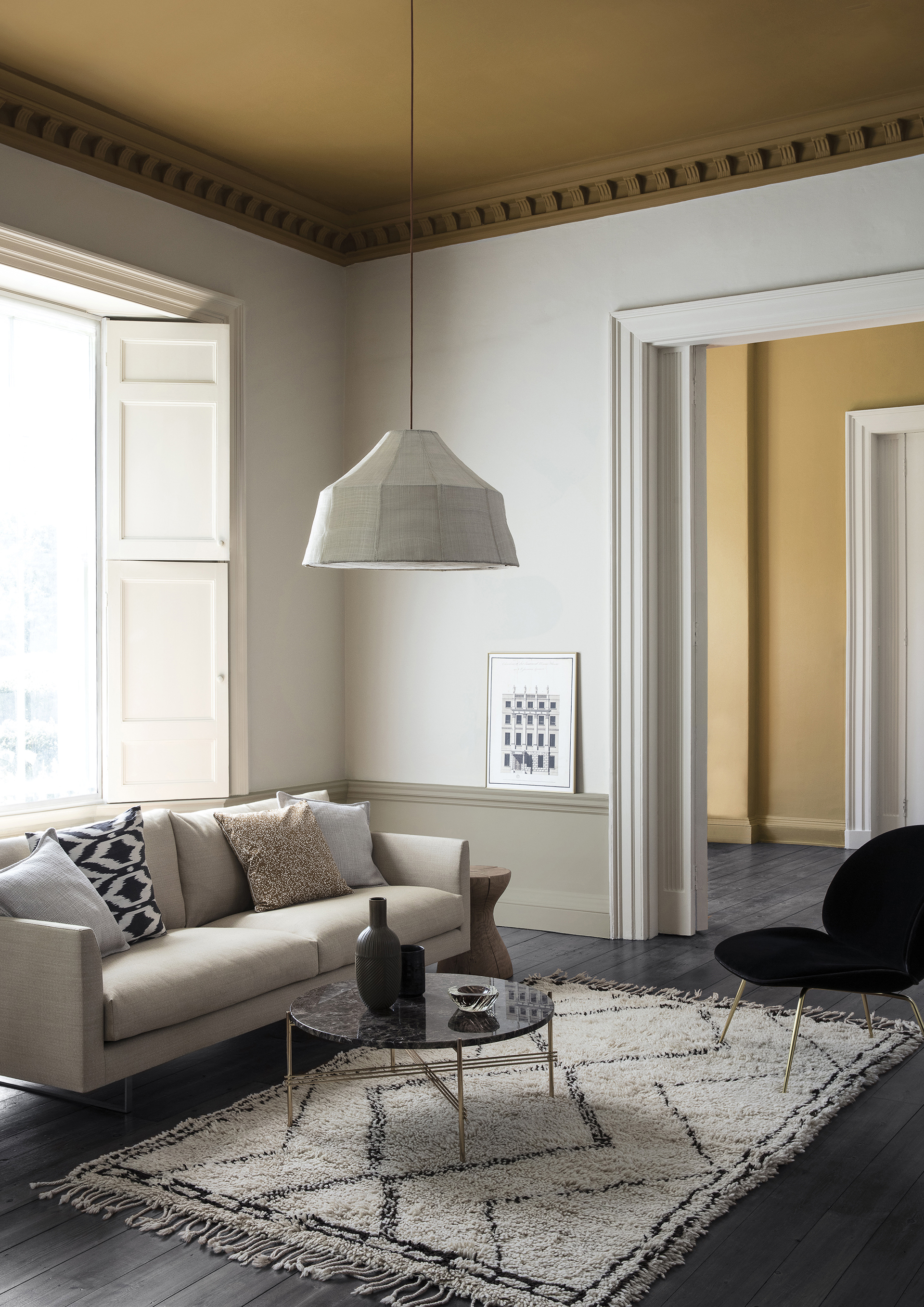 living room with flat cream walls and yellow ceiling