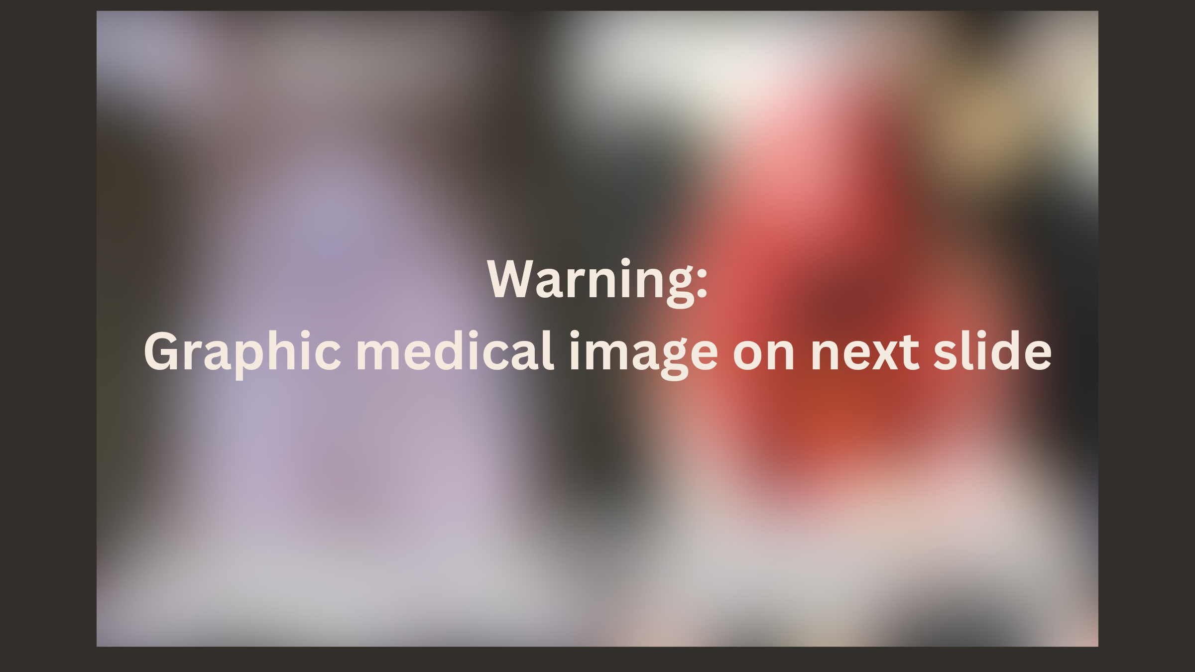 Content warning written across a blurred image. The text reads "Warning: Graphic medical image on next slide"
