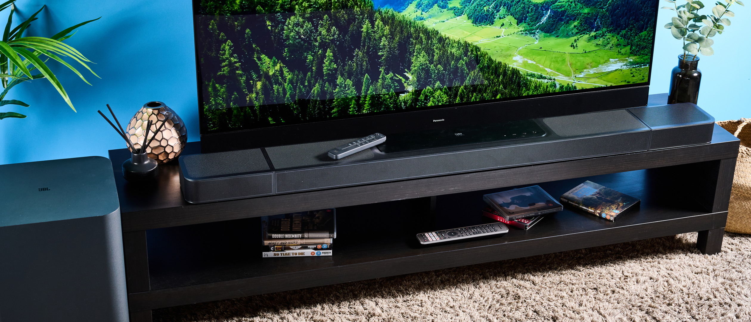 the jbl bar 1300x a black soundbar with HDMI ports, two surround channel speakers, a subwoofer wirelessly connected