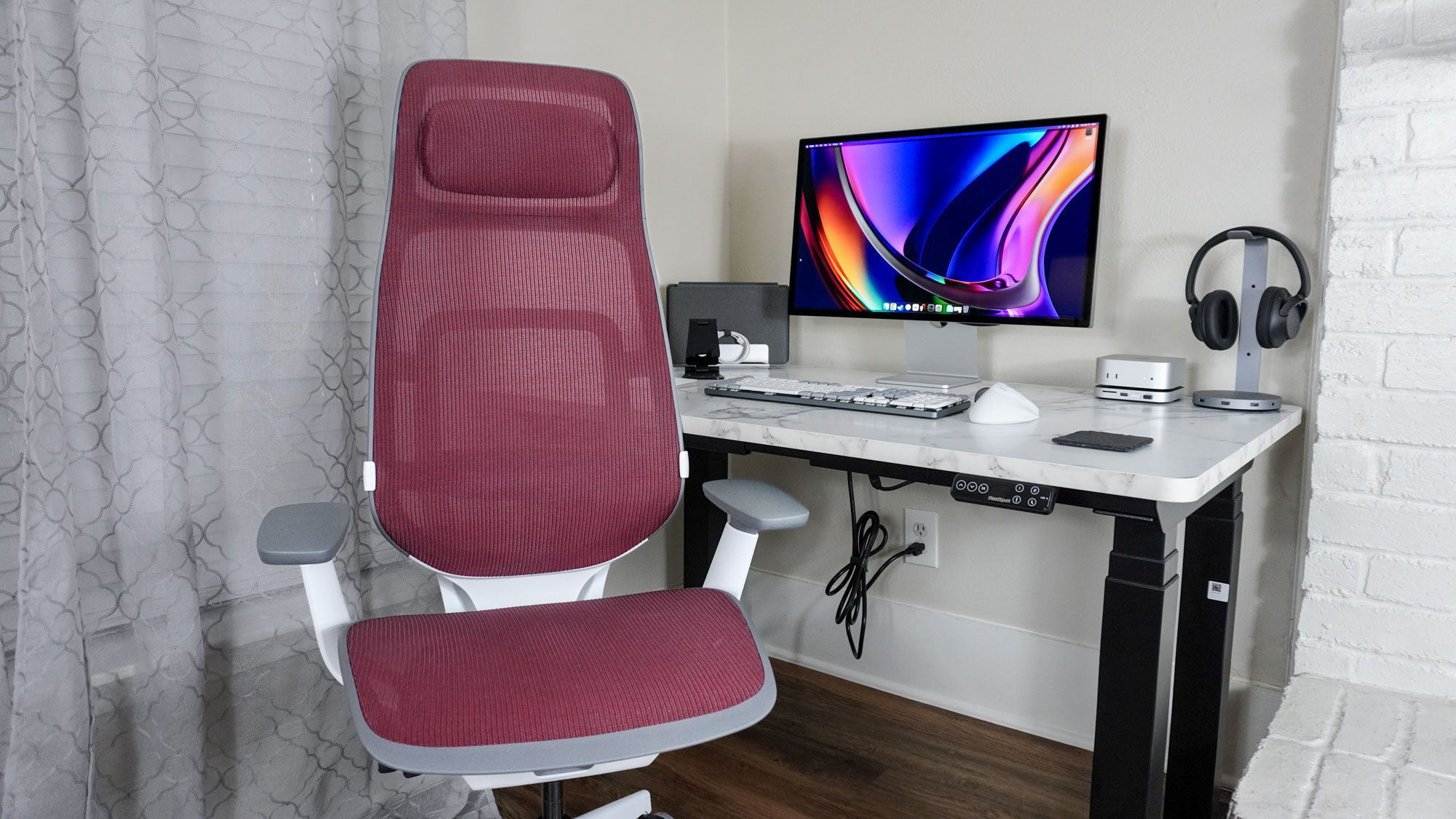The Steelcase Karman High Back in front of a desk