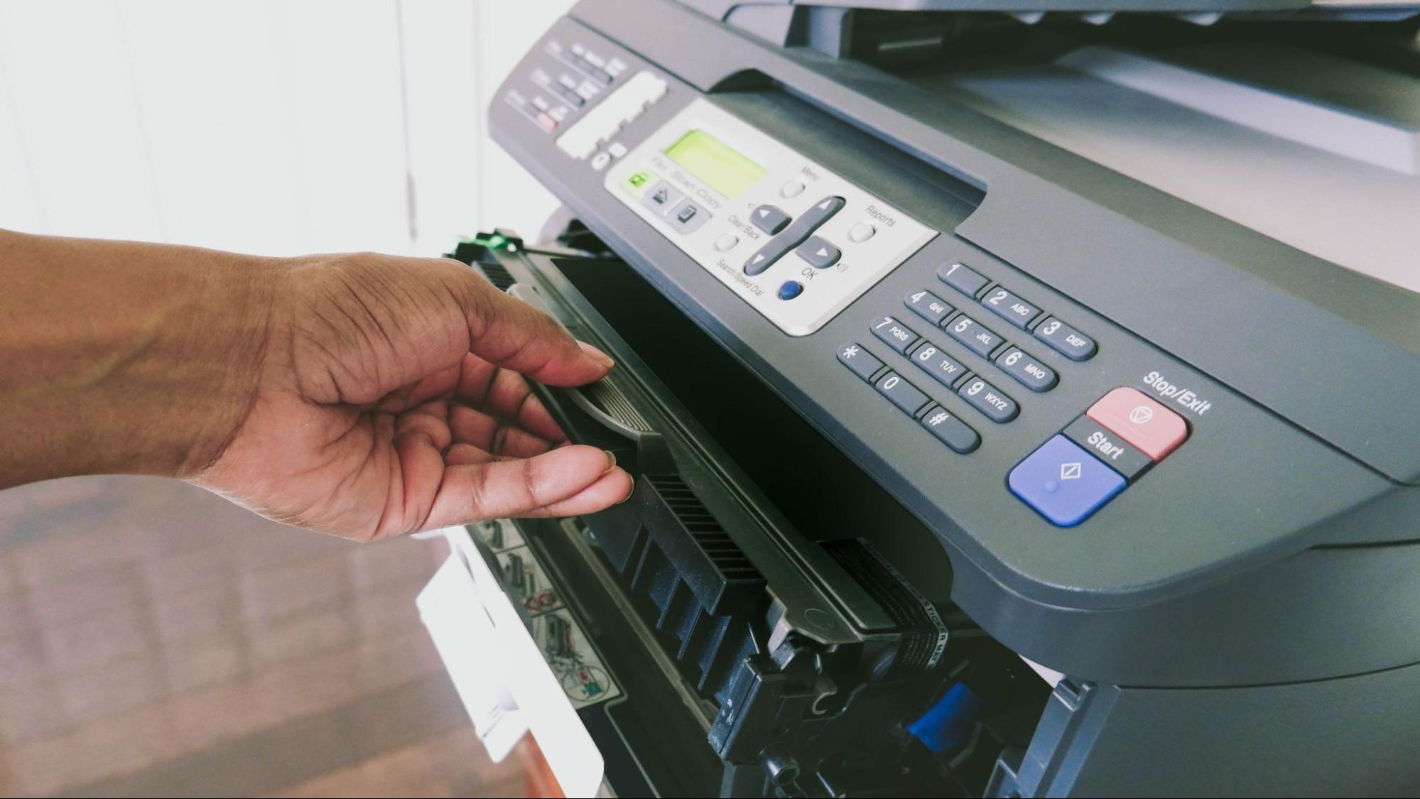Replacing a toner cartridge in a laser printer