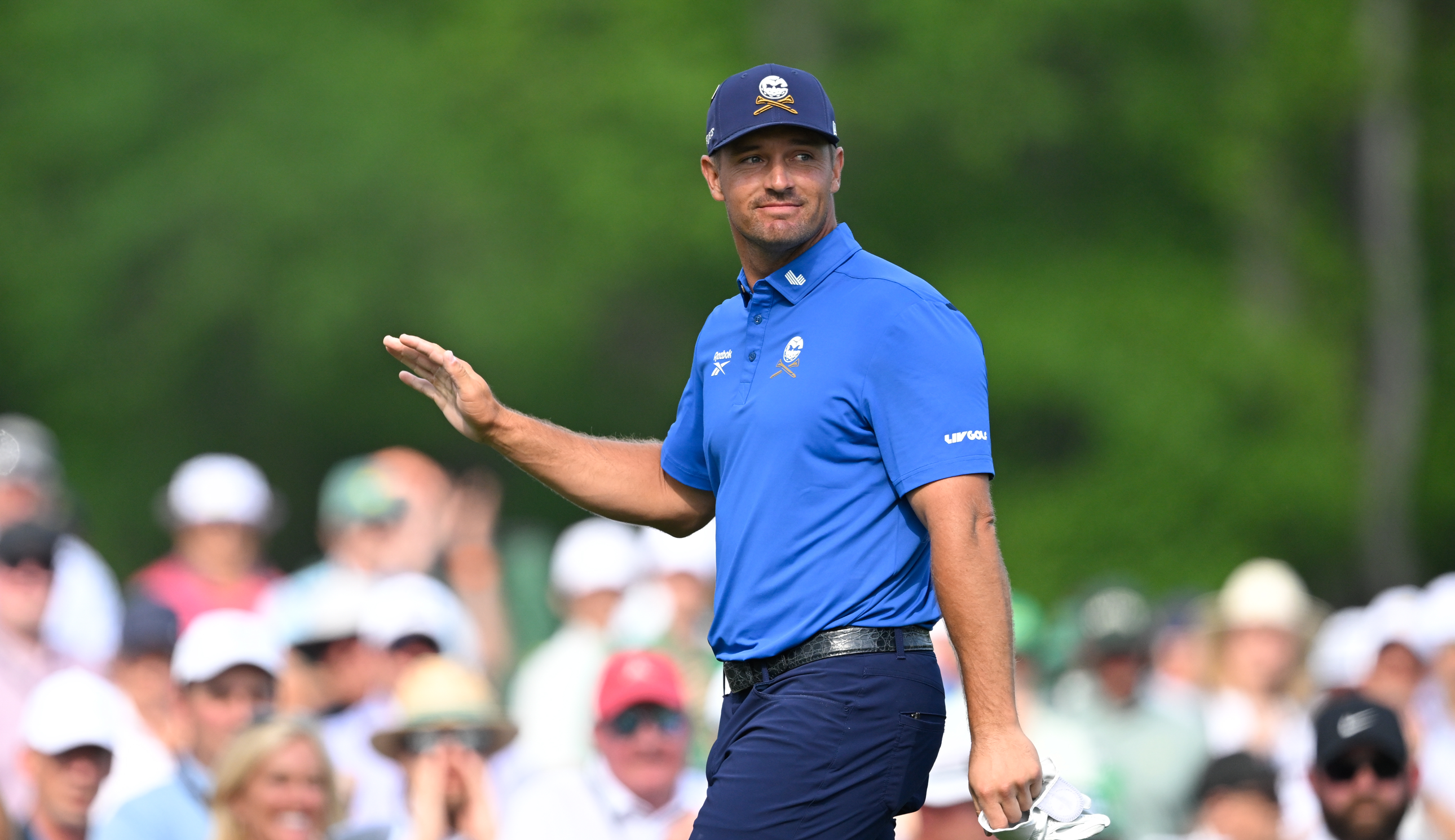 Bryson DeChambeau waves to the crowd