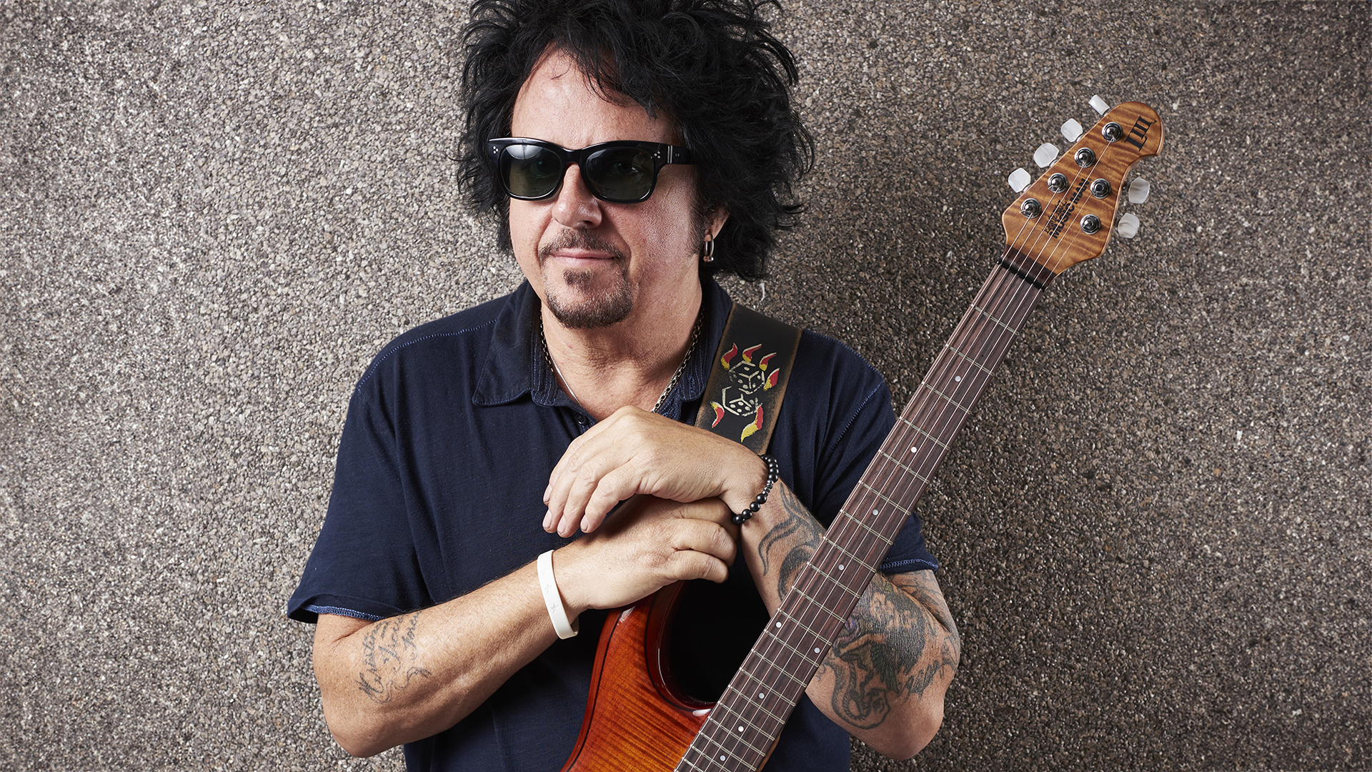 Portrait of American rock musician Steve Lukather, photographed with his Ernie Ball Music Man LIII electric guitar backstage at Notodden Blues Festival in Norway, taken on August 5, 2016.