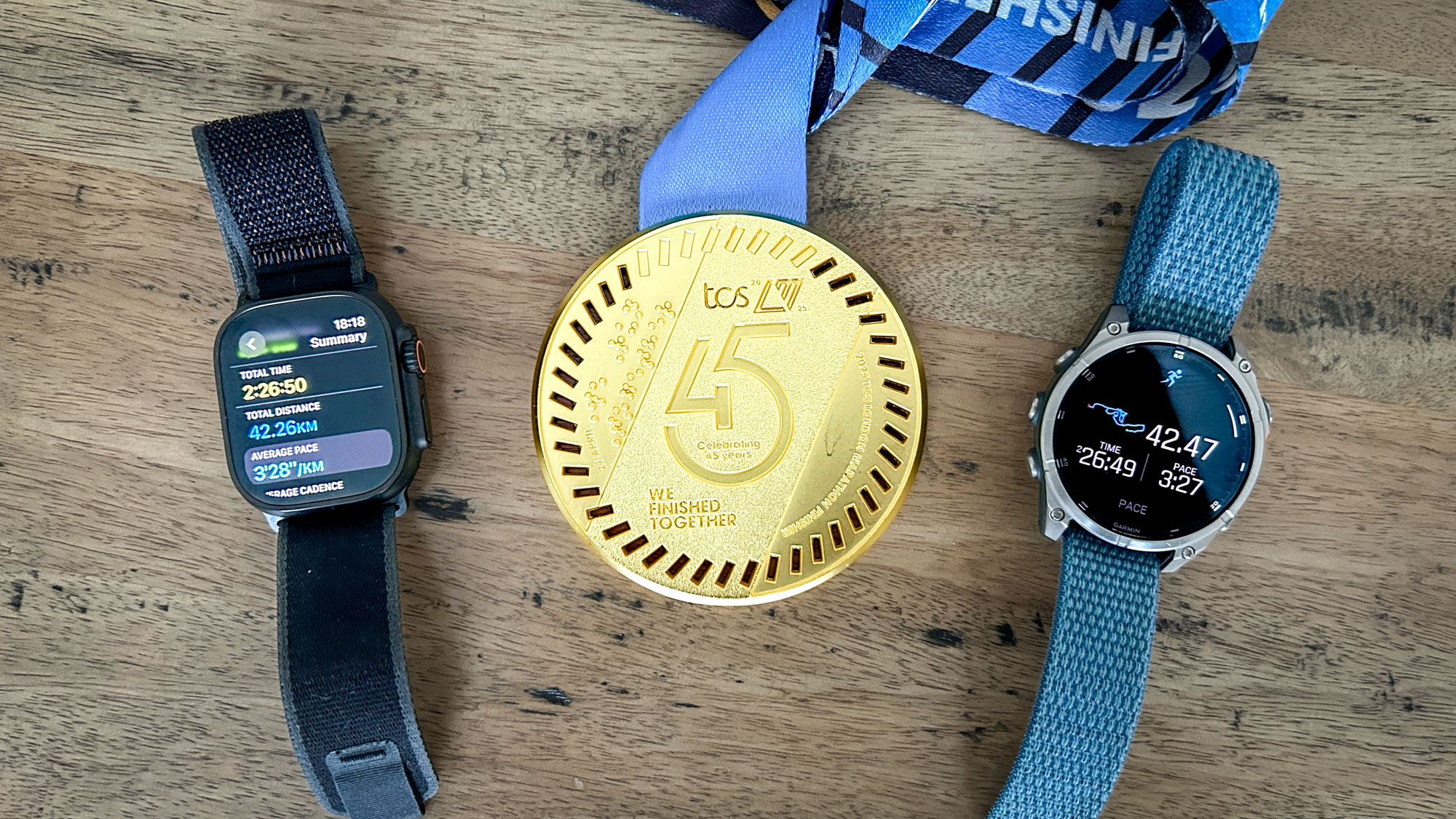 Garmin Fenix 8 and Apple Watch Ultra 2 and London Marathon medal