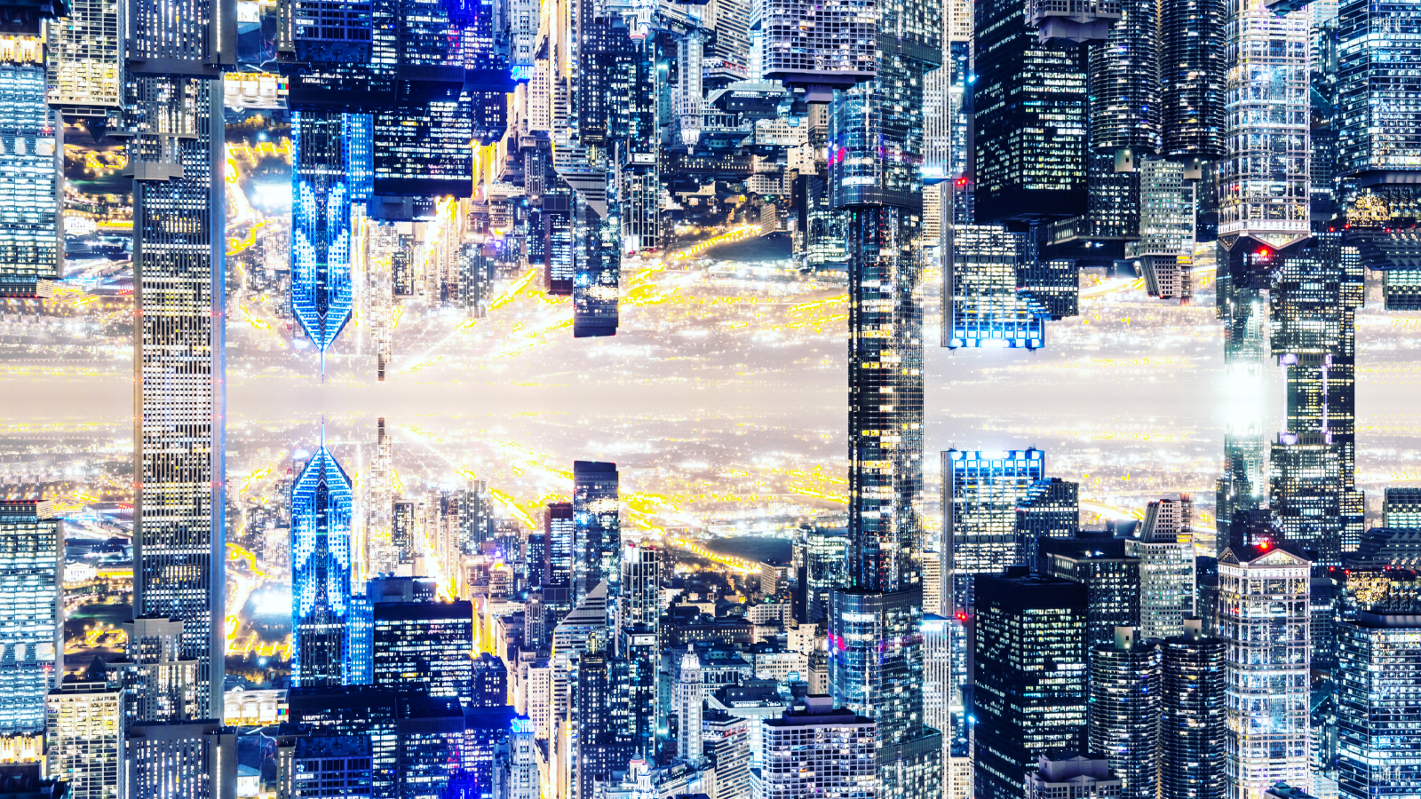 Image manipulation of the Chicago skyline with mirror effect, creating a new dimension with the city connecting upside down by the skyscrapers.