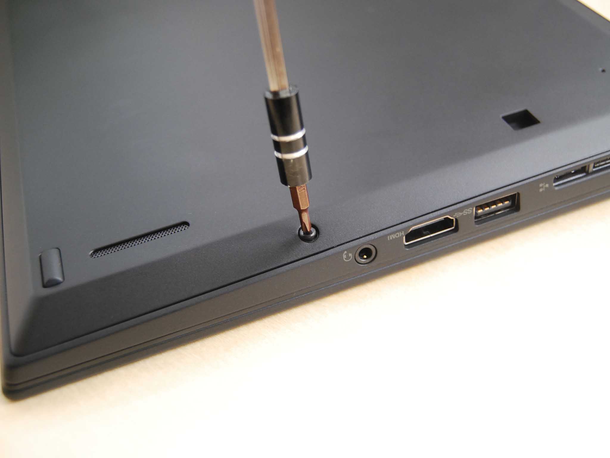 Screw in the five black fasteners