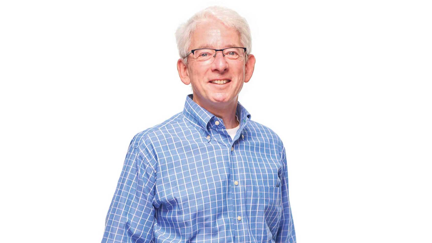 Peter Atwater stands for a photographic portrait of himself
