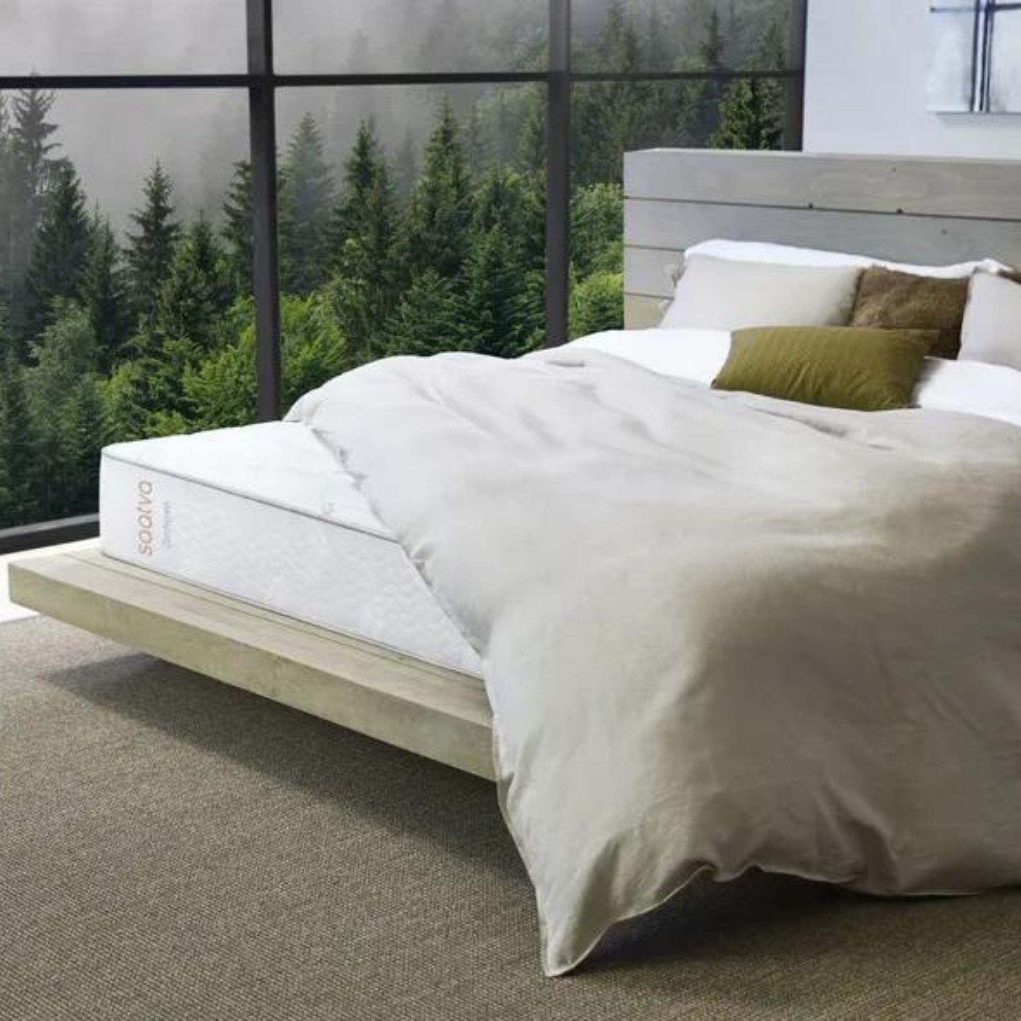 Saatva Zenhaven Latex Mattress against a wall of windows.