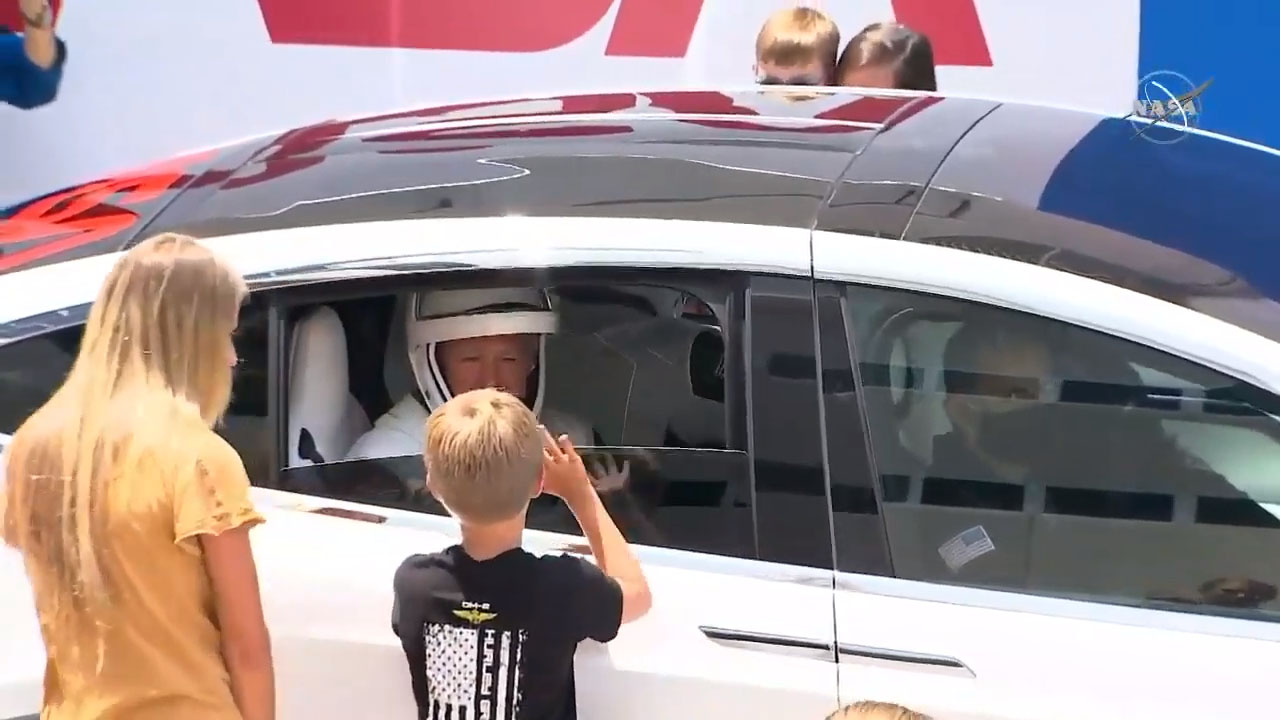 Demo-2 astronaut Doug Hurley says goodbye to his family from inside the Tesla that transported him and his crewmate Bob Behnken to the launch pad, on May 30, 2020.