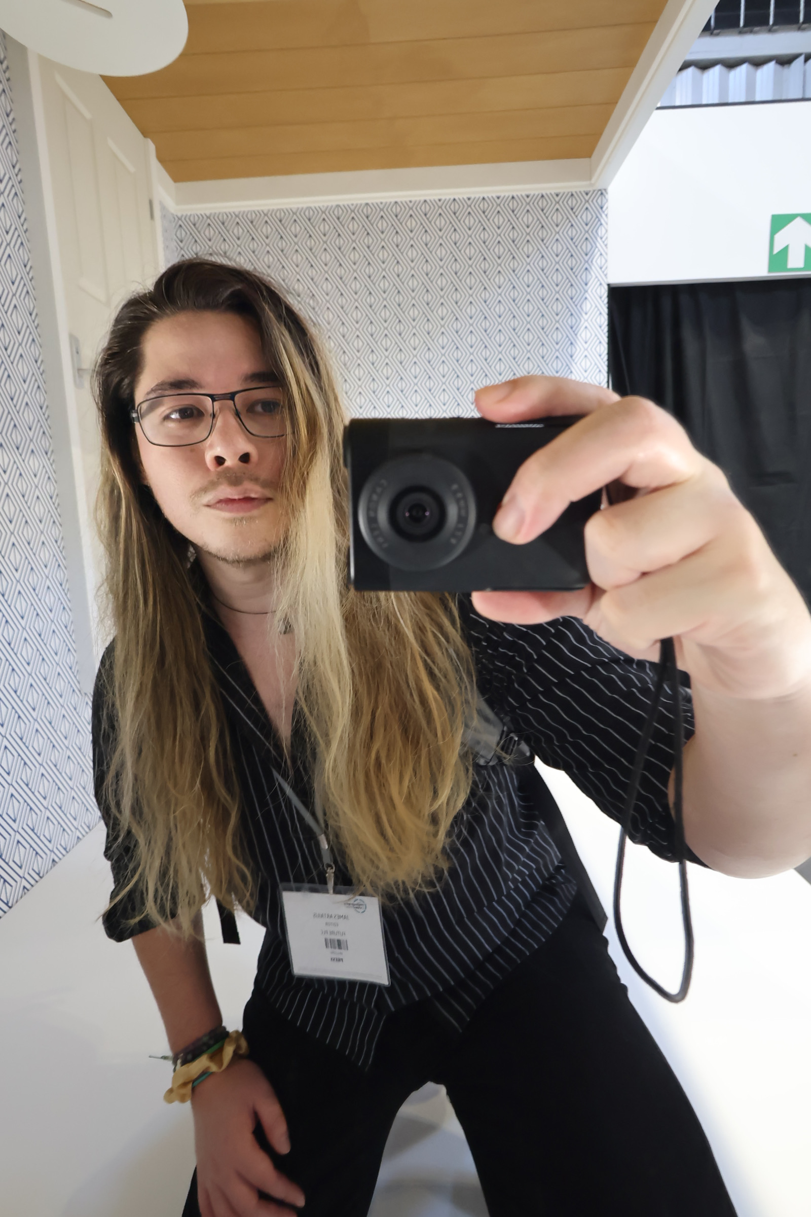 Photographer James Artaius holding a Canon PowerShot V10