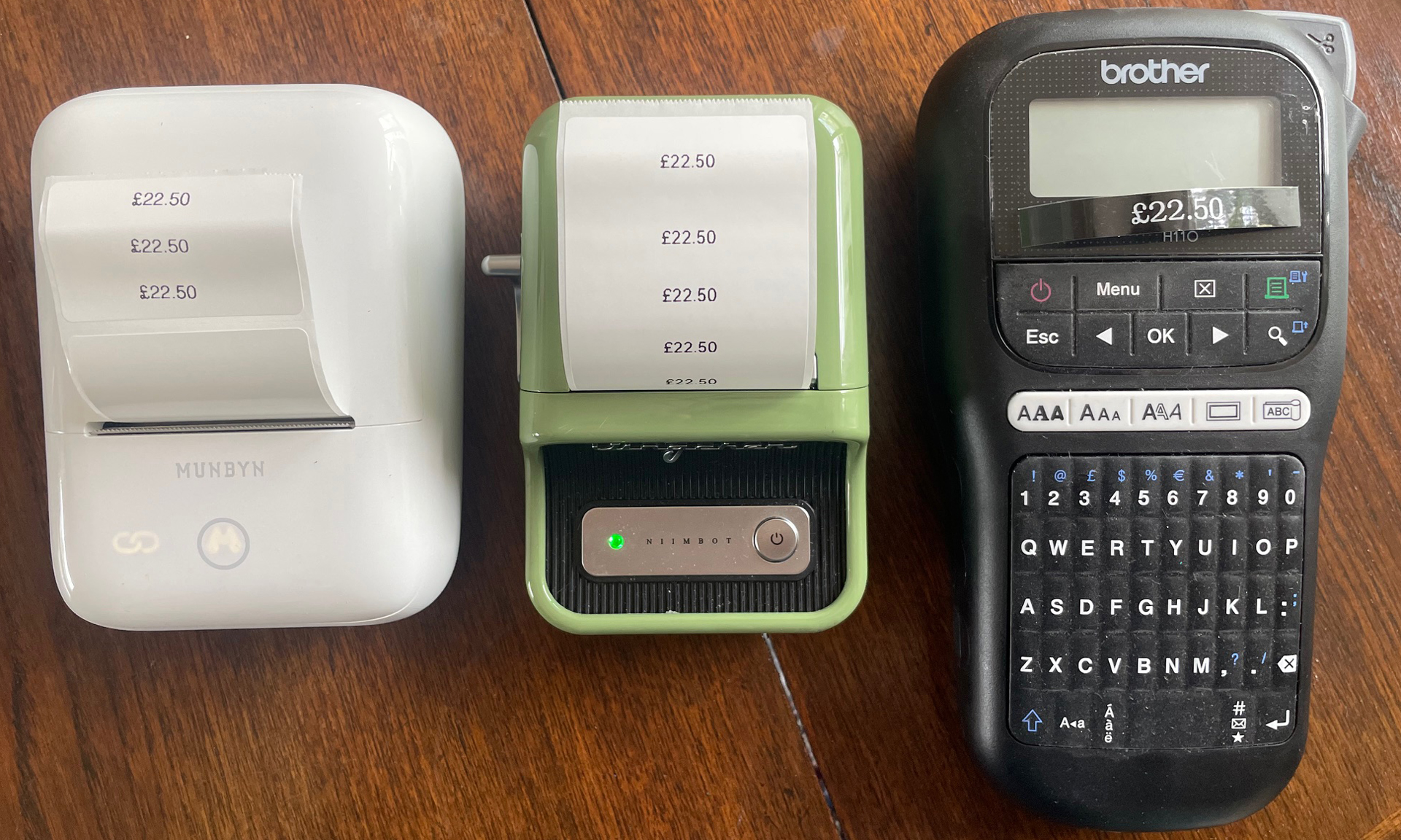 three label makers in a row with labels saying £22.50 coming out of them