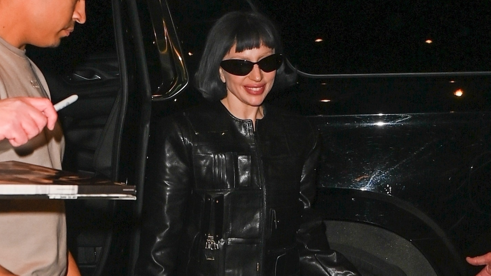 Lady Gaga leaving rehearsals wearing a tory burch handbag jacket