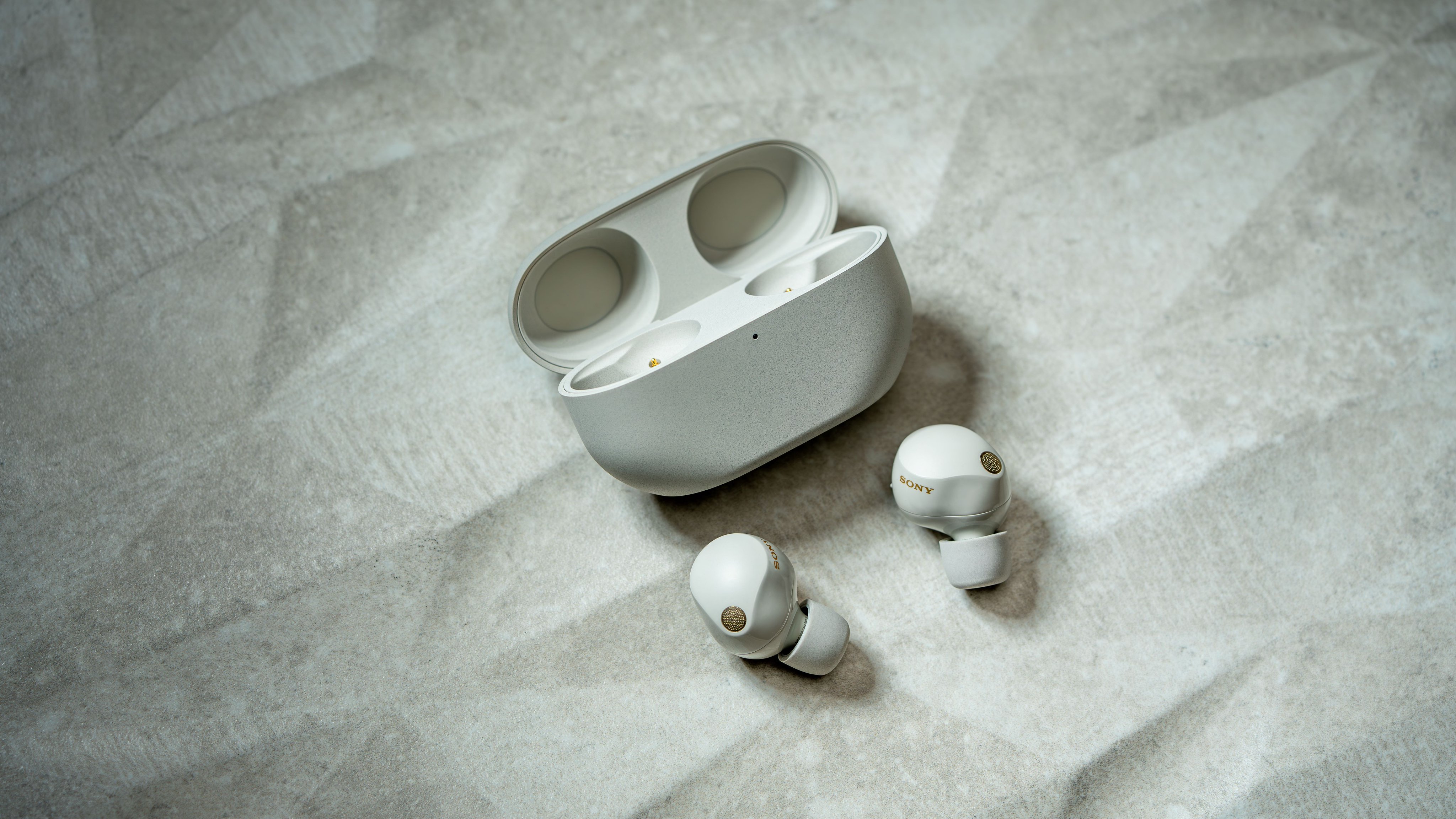 The Sony WF-1000XM5 in silver.