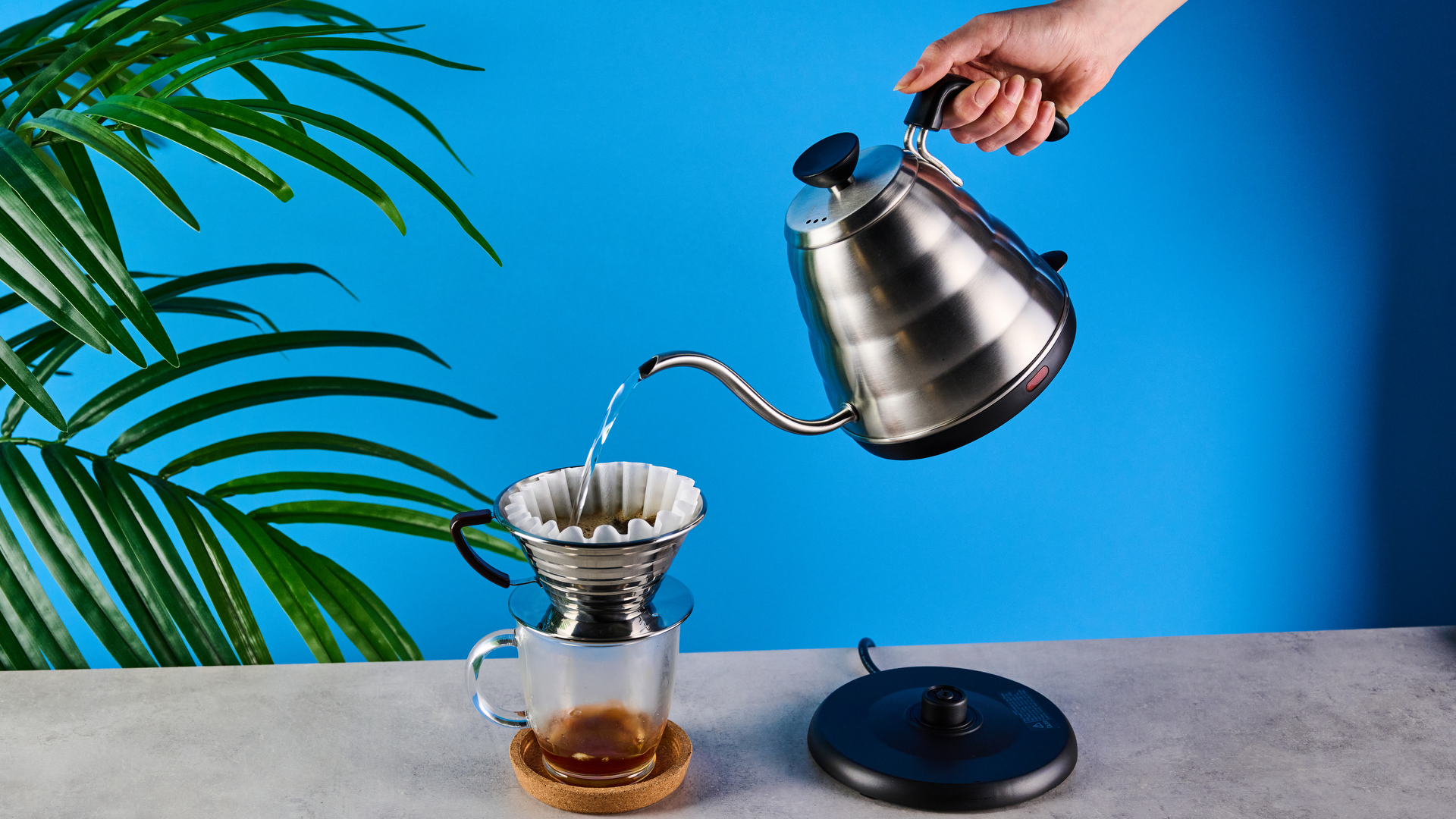 hario v60 buono gooseneck kettle, a stainless steel kettle with electric base, handle, and gooseneck spout, for specialty coffee