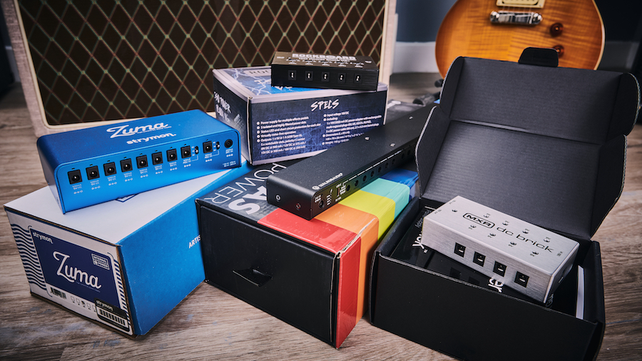 Multiple pedal power supplies stacked on their boxes