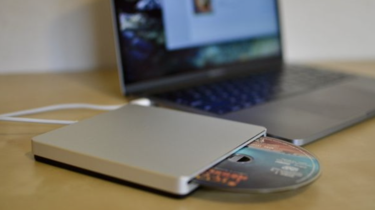 An image of a disk drive and a laptop
