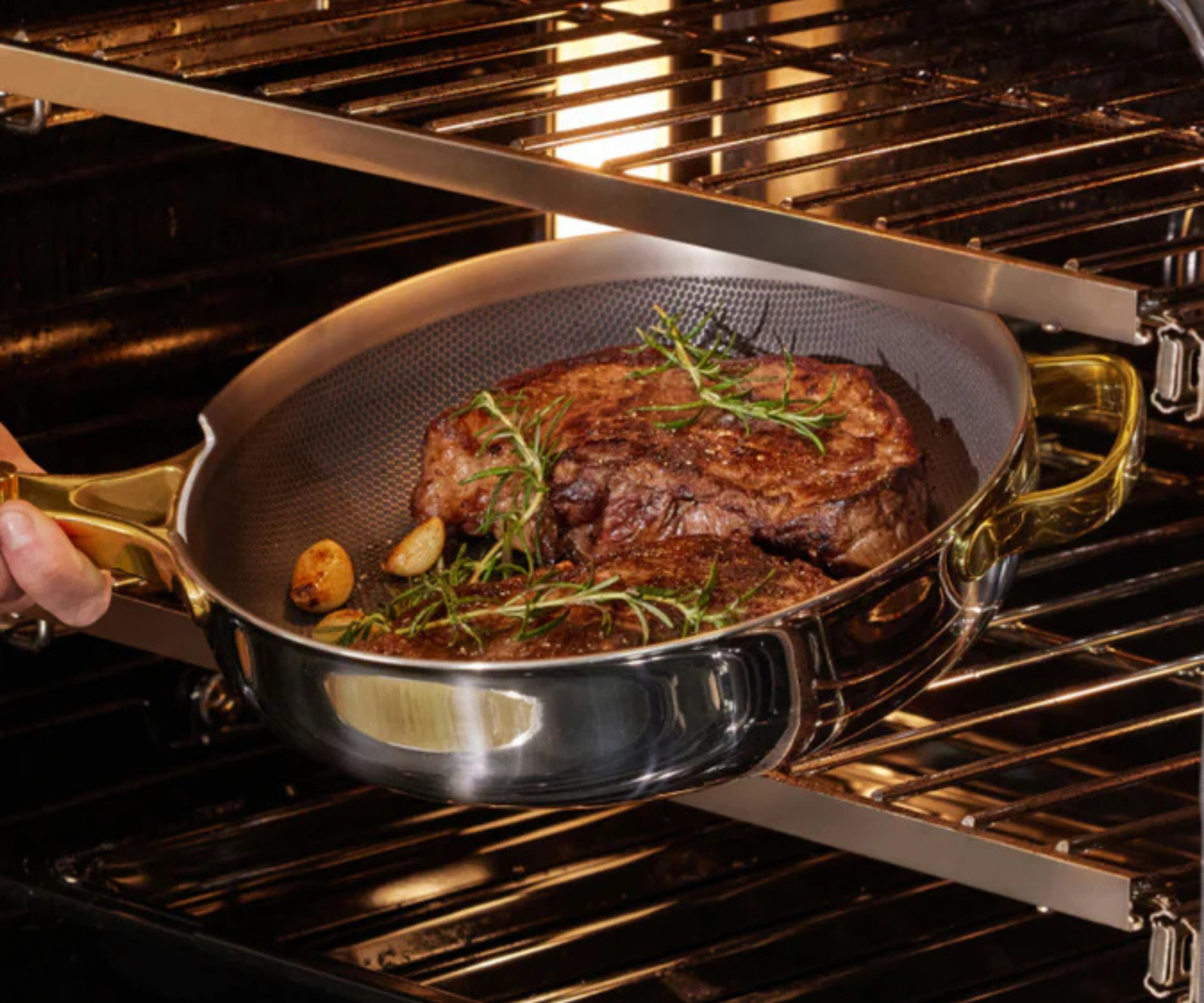 Our Place Titanium Always Pan Pro sizzling onions, chilli and steaks in the kitchen 