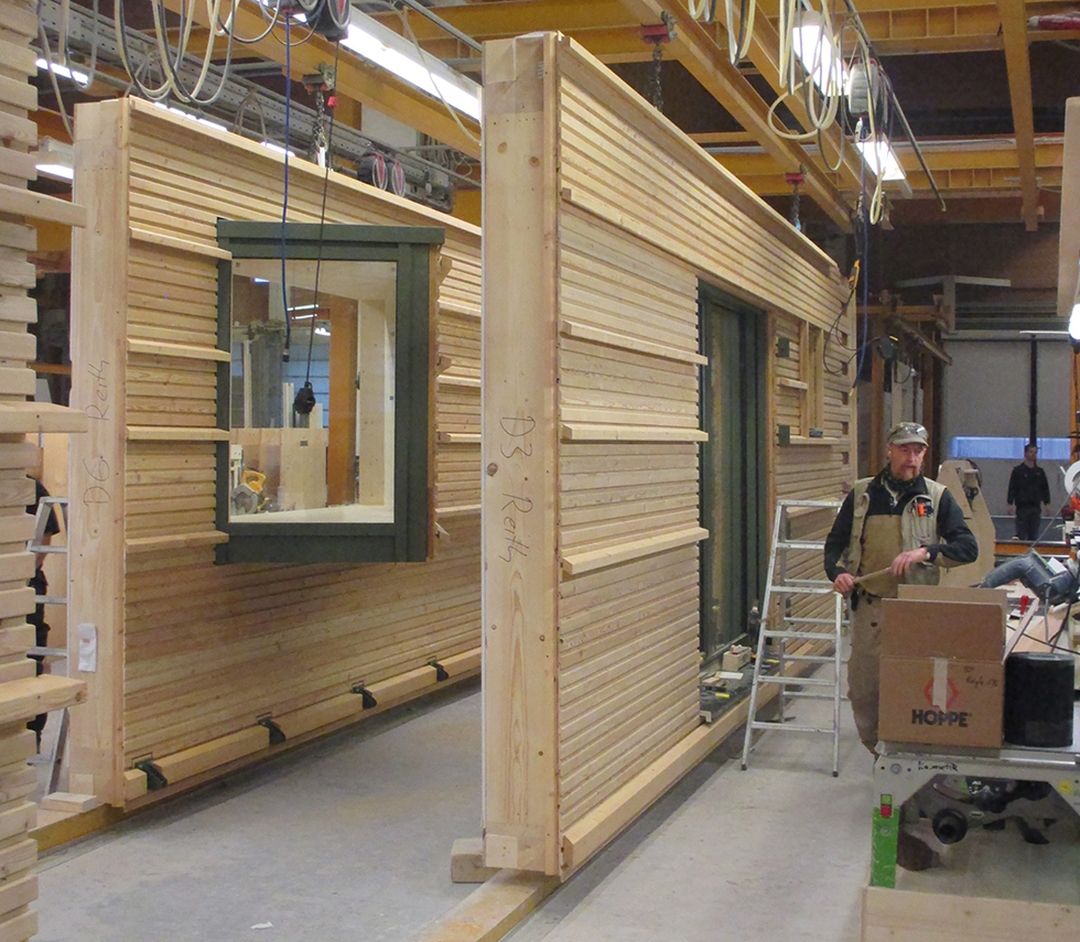 Here we see panels being constructed in a Baufritz factory. Even the windows are fitted to so that on-site construction is as quick as possible