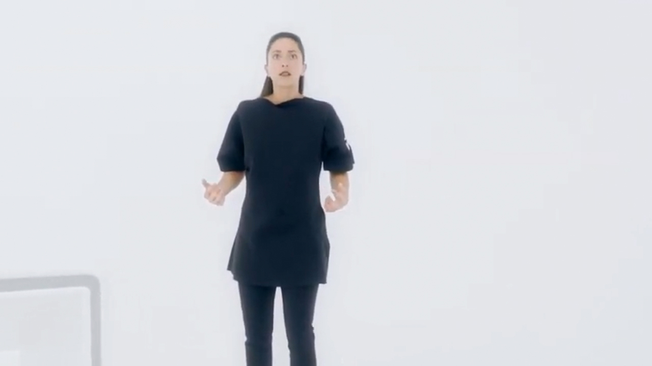 Oona Chaplin in front of a plain white background in Black Mirror