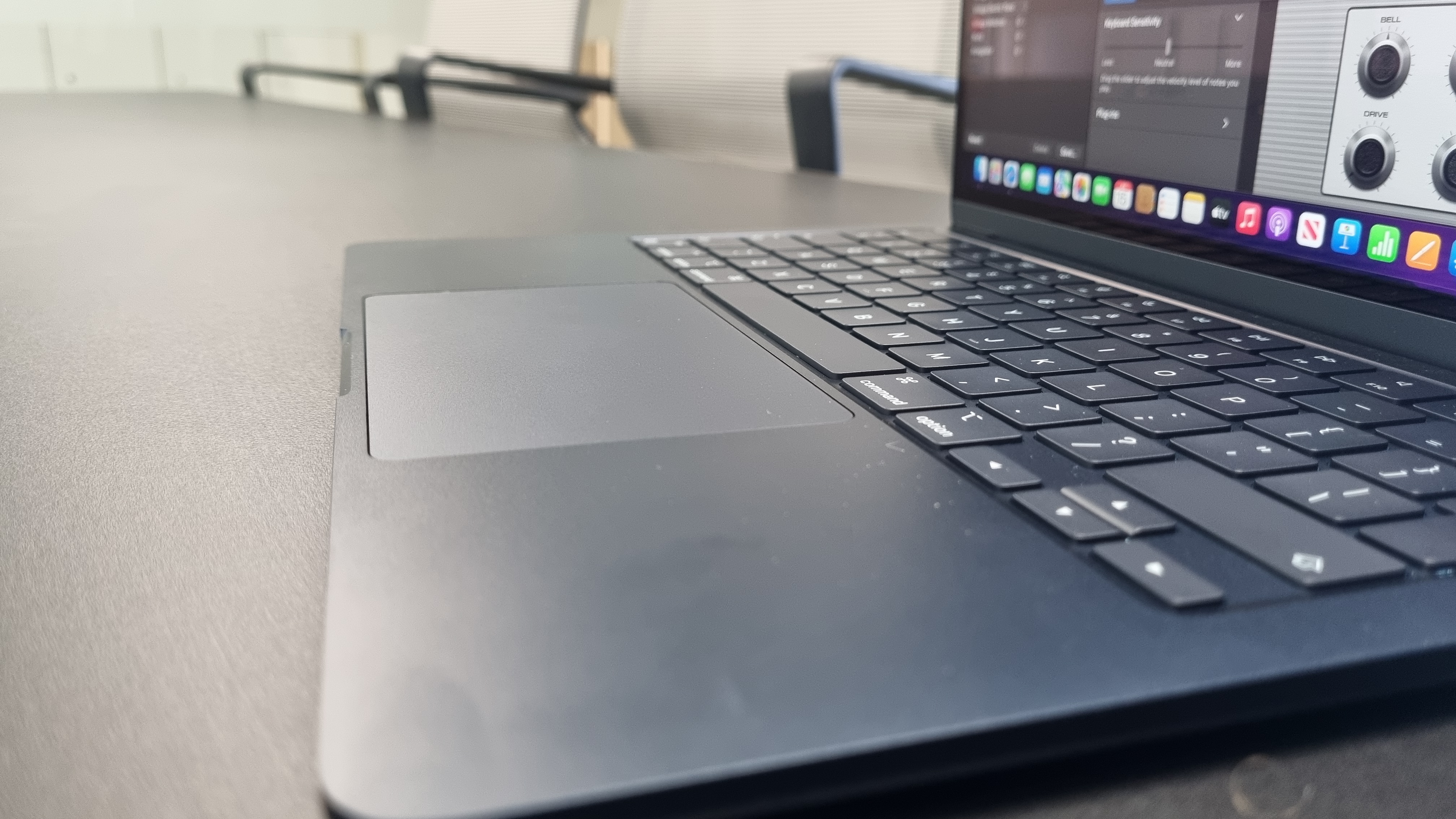 MacBook Air laptop in an office on a black desk