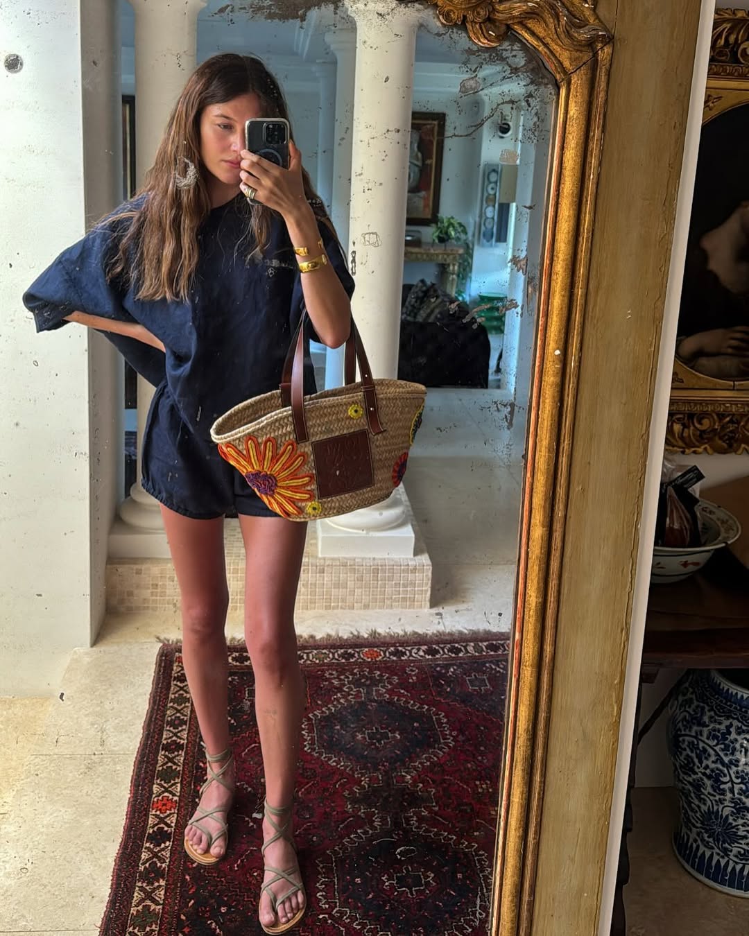 woman wearing matching linen set and gladiator sandals