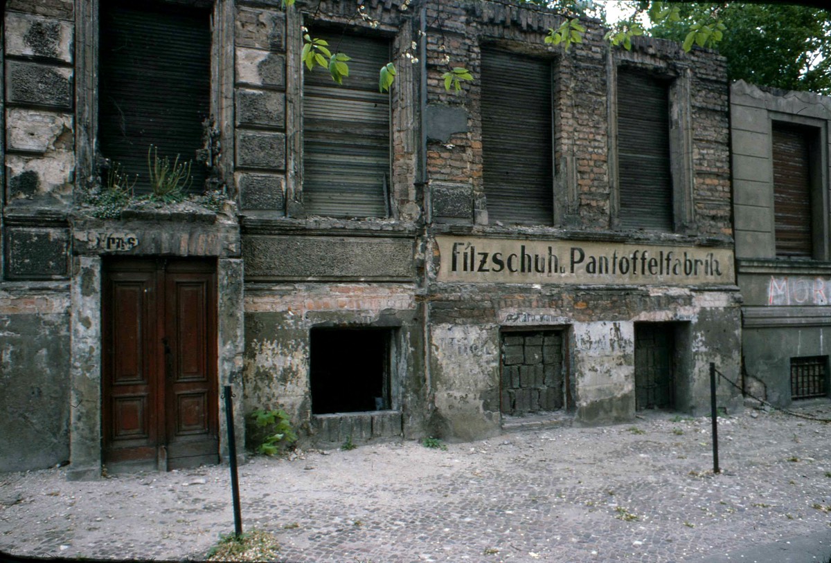 Buildings bricked up to form part of the 'Berlin Wall' before the wall was built. The building on the right was a 'felt shoe and slipper factory' at some time.